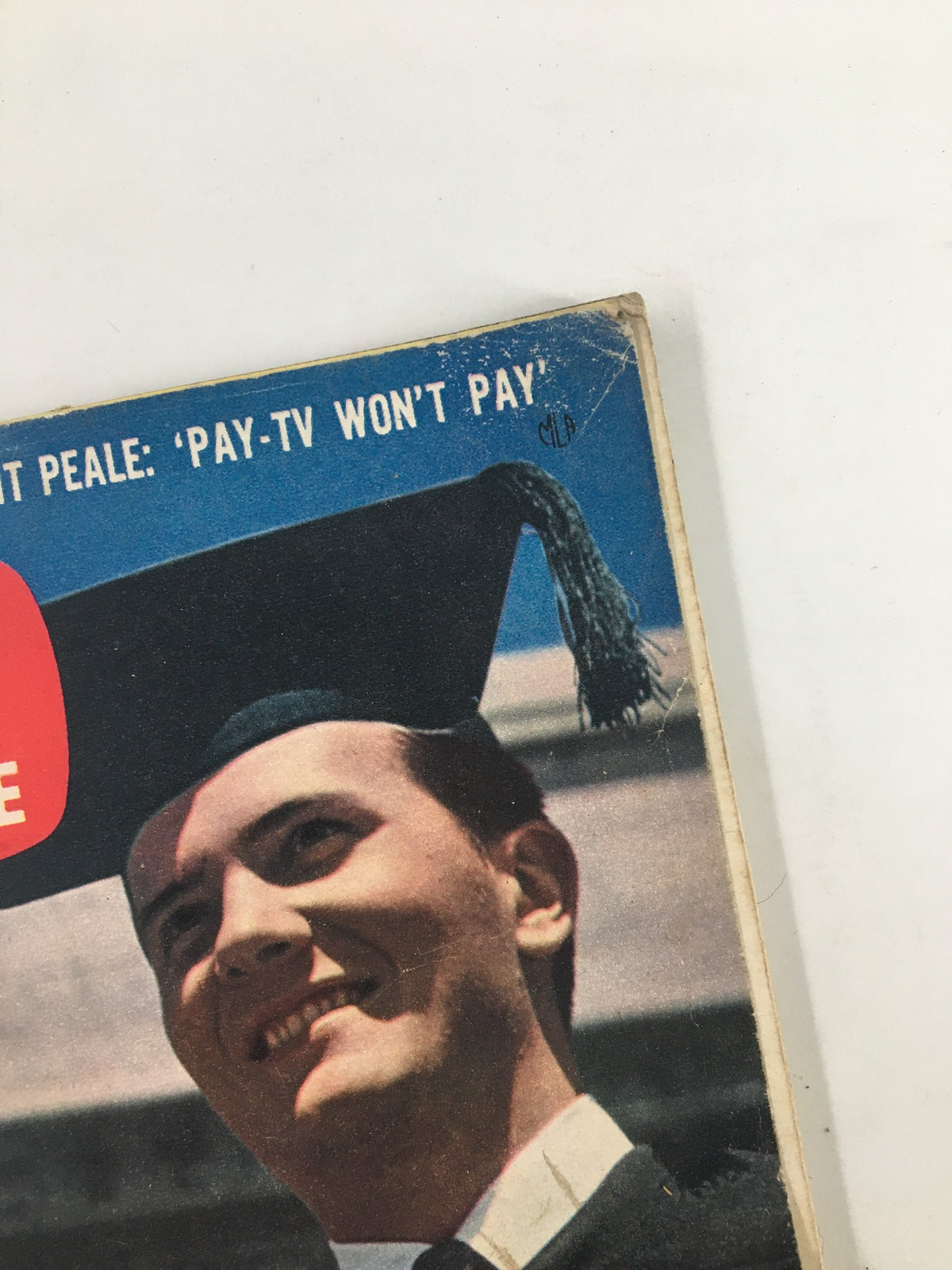 Close-up of the cover of TV Guide Magazine from June 7, 1958, featuring Pat Boone, showcasing a smiling young man in graduation attire with a dark background, excellent for vintage magazine collectors.