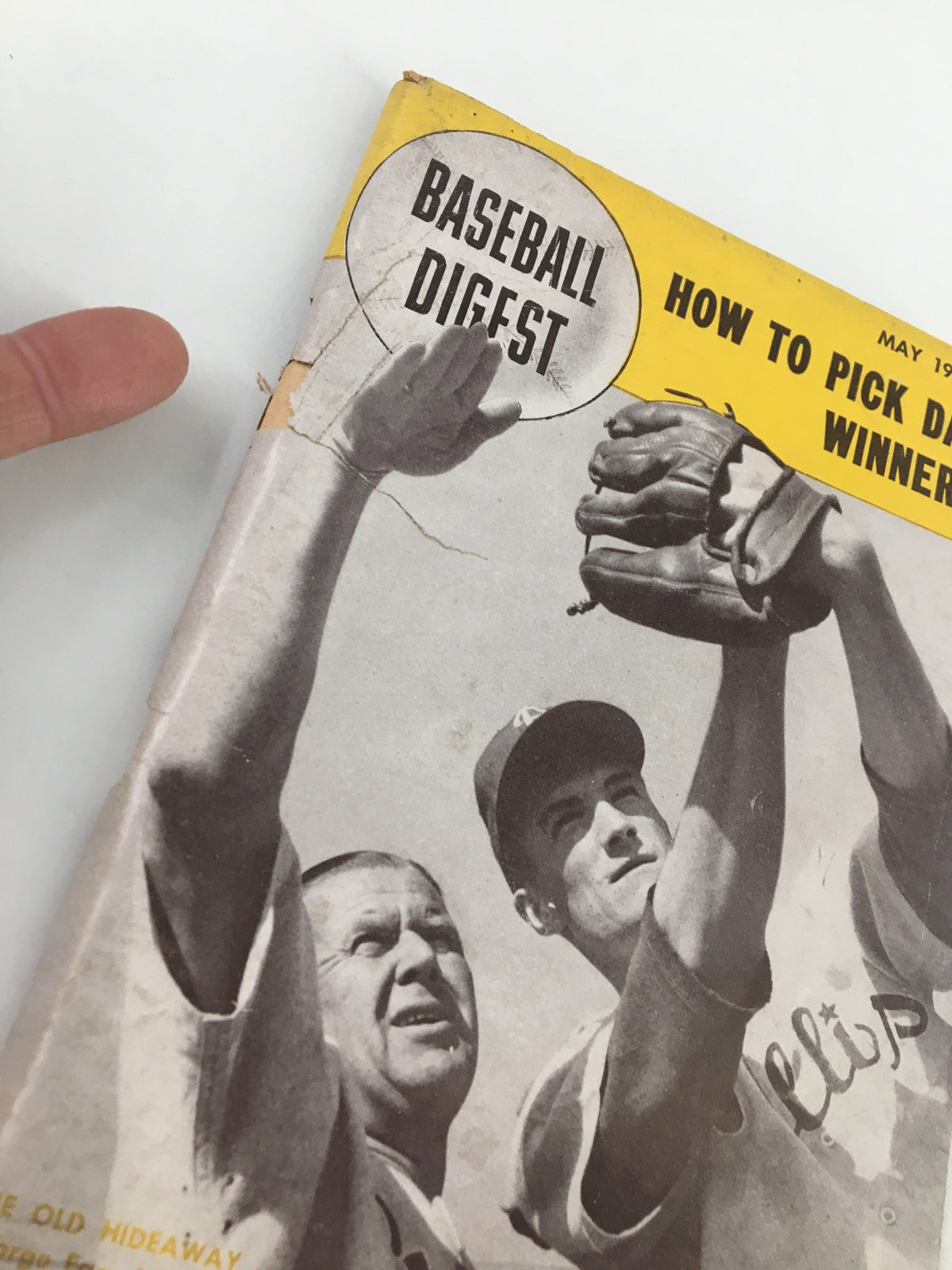 Close-up view of the cover of VTG Baseball Digest Magazine from May 1951, emphasizing the title 'Baseball Digest' and features George Earnshaw and Bill Fogg.