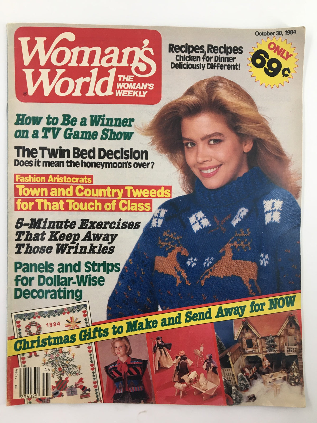 Cover of Woman's World Magazine October 30 1984 featuring the article 'The Twin Bed Decision'. The magazine showcases content related to fashion, recipes, and home crafts. A woman wearing a blue sweater with deer patterns smiles at the camera.