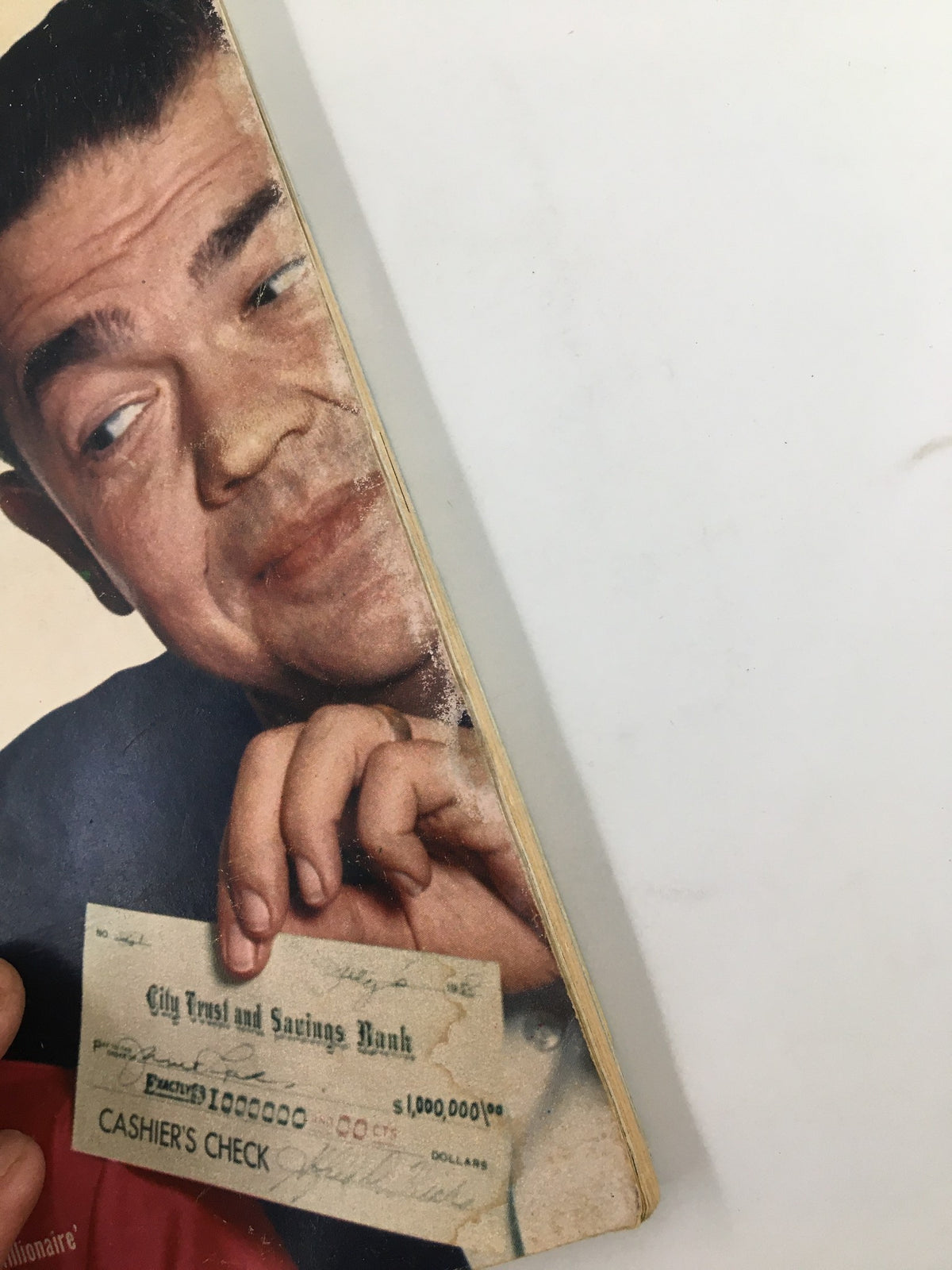 Detail from TV Guide Magazine July 26, 1958 featuring actor Marvin Miller holding a cashier's check. This image highlights the magazine's vintage aesthetic and cultural significance in American television history.