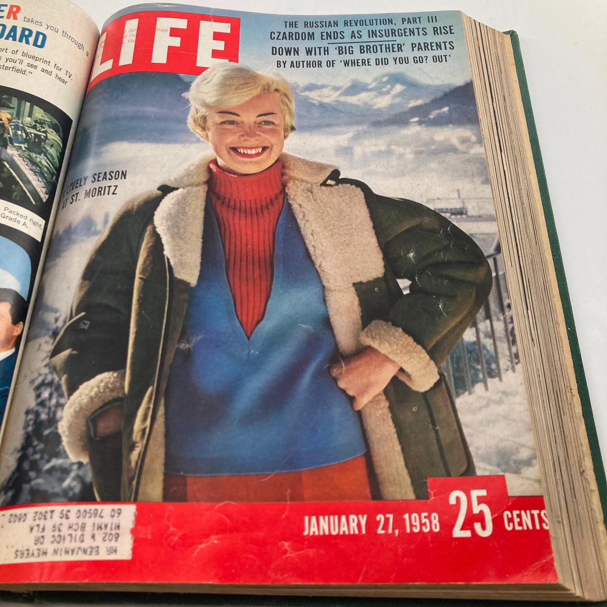 Cover of the January 27, 1958 issue of Vintage 1958 Bound Life Magazine, featuring a woman in vibrant winter fashion at St. Moritz.