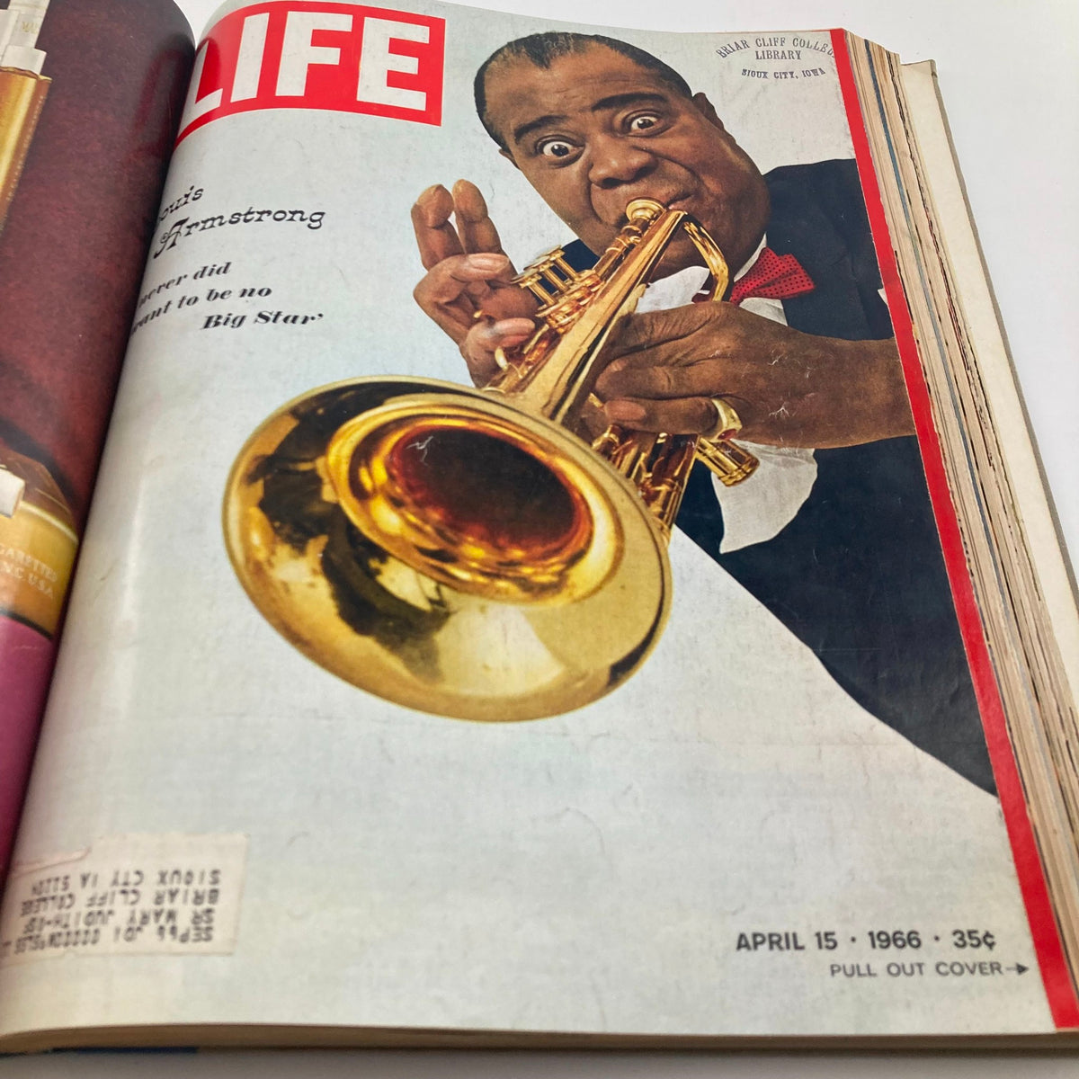 Cover of the VTG 1966 Bound Life Magazine featuring Louis Armstrong with his trumpet, celebrating his influential career in music during the vibrant 1960s.