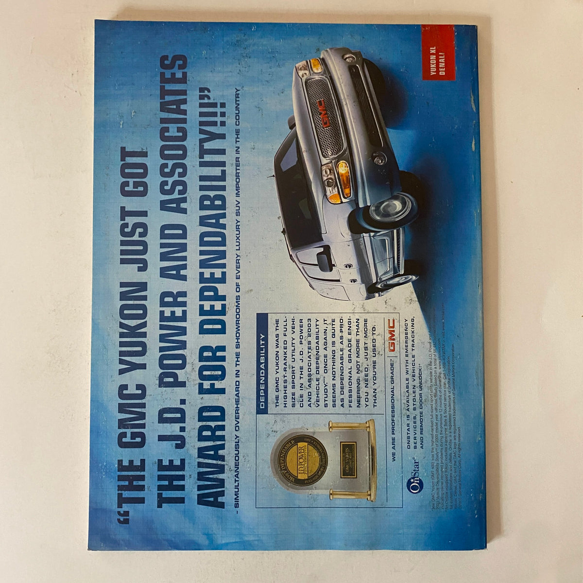 Back cover of Fortune Magazine December 29, 2003, highlighting the GMC Yukon and its award for dependability, showcasing advertising from that time.