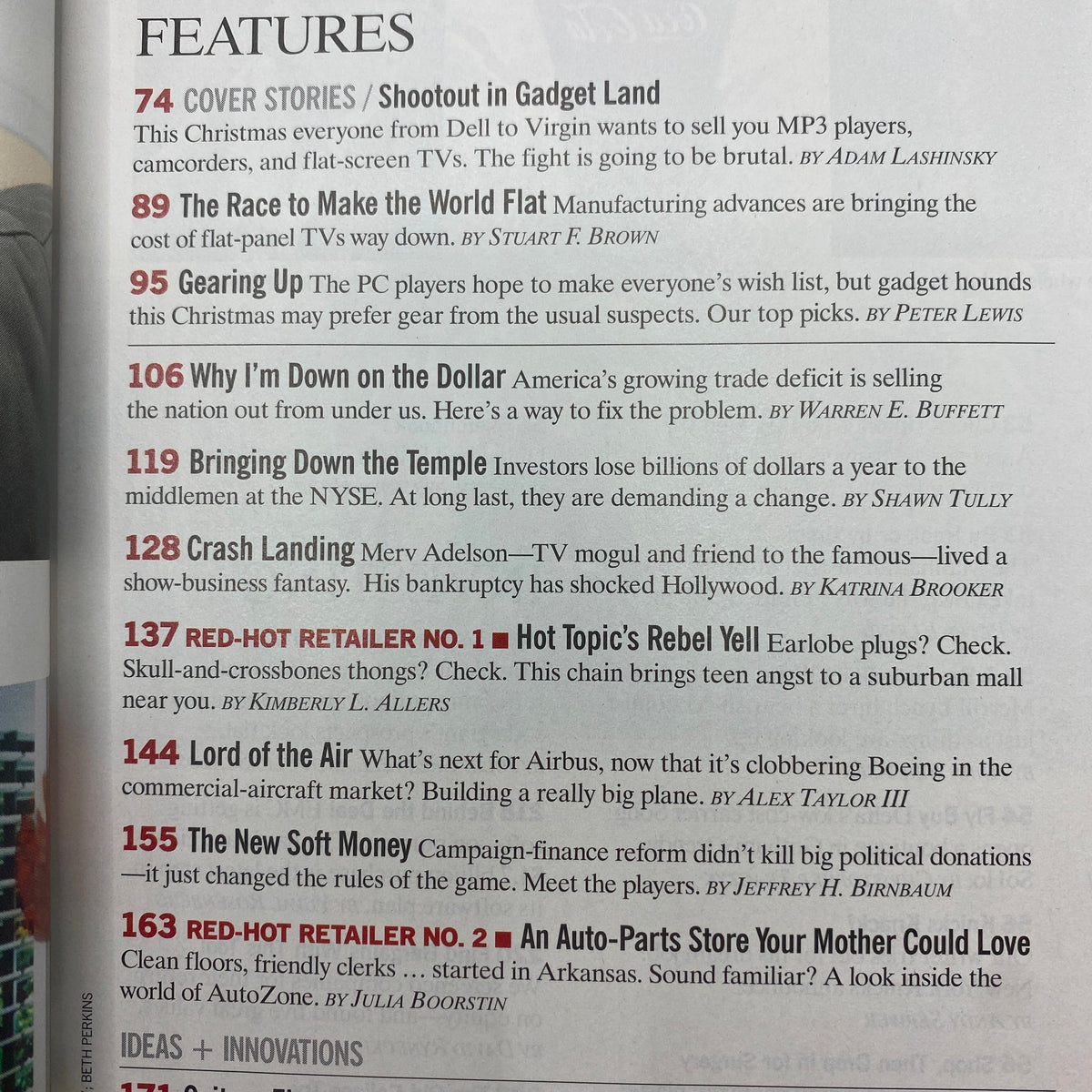 Fortune Magazine November 10, 2003 featuring articles such as 'Shootout in Gadget Land' and 'The Race to Make the World Flat' with insights on early 2000s technology.