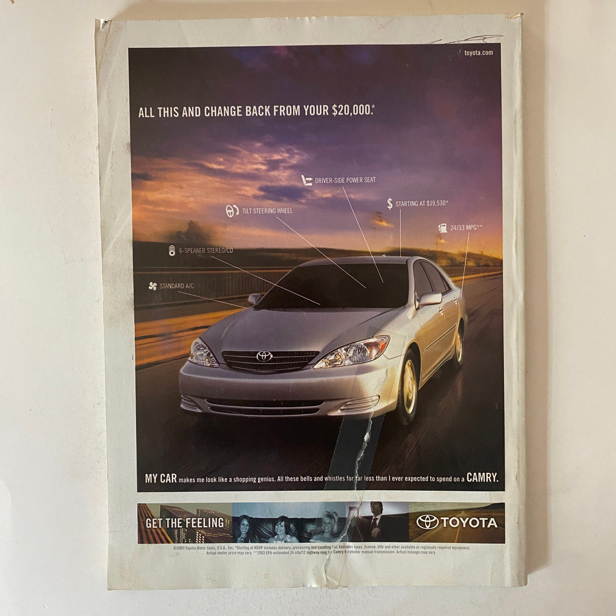 An advertisement for the Toyota Camry featured in Fortune Magazine November 10, 2003, showcasing the car's features and pricing.