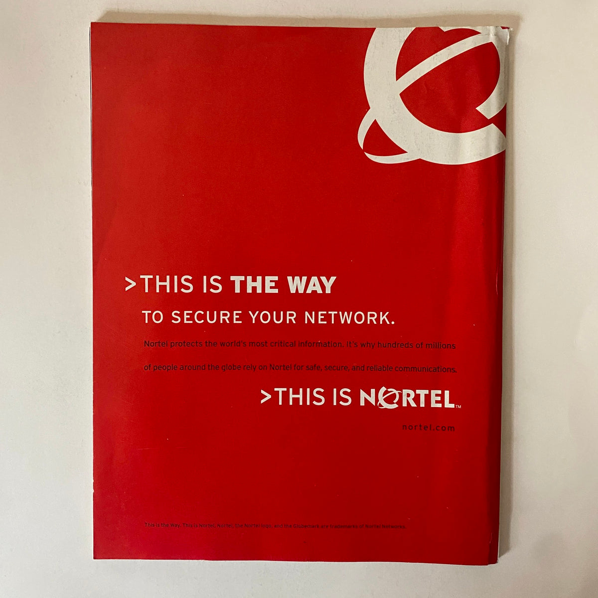 Back cover of Fortune Magazine February 6, 2006, featuring a red advertisement for Nortel with the message about securing networks, emphasizing corporate branding.