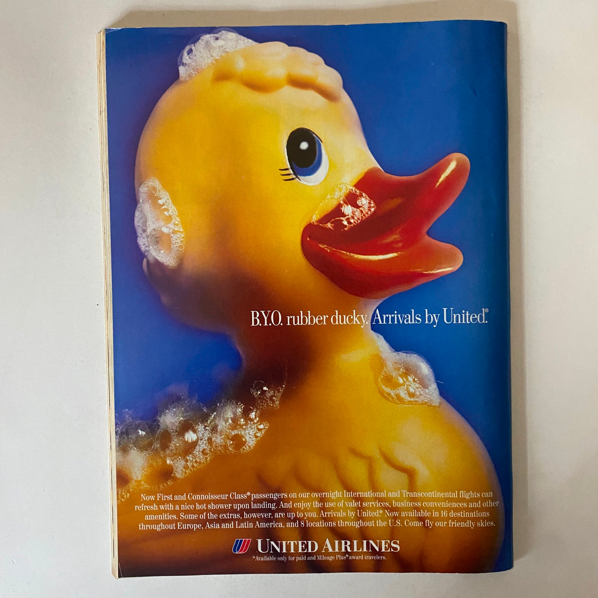 Back cover of BusinessWeek Magazine December 9, 1996, featuring a playful advertisement for United Airlines with a rubber ducky in a bath, promoting unique amenities for travelers.