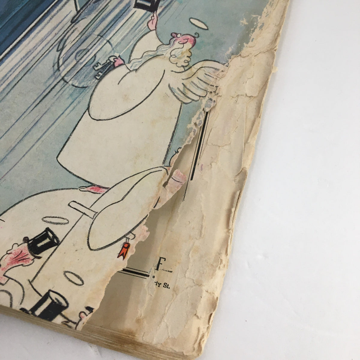 Close-up of the torn edge of the cover of The New Yorker Magazine October 13 1934 featuring the Highway Heaven exhibit by Rea Irvin, illustrating vintage magazine wear and age.