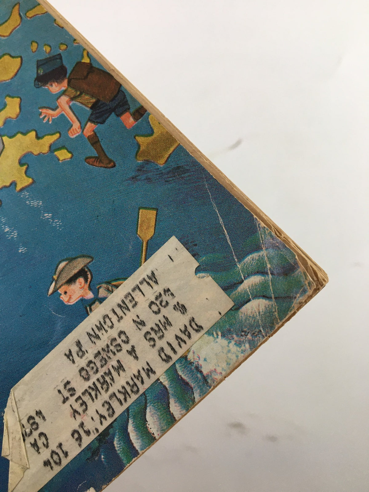 Close-up view of the July 1963 Boys' Life Magazine, featuring the cover illustration related to the 11th World Jamboree in Athens, Greece. The image showcases vibrant colors and vintage artwork that captures the adventurous spirit of scouting and outdoor exploration.
