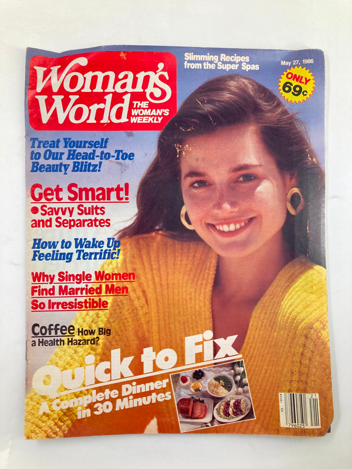 Cover of Woman's World Magazine May 27 1986 featuring a smiling woman in a yellow sweater, highlighting articles on beauty, slimming recipes, and how to wake up feeling terrific.