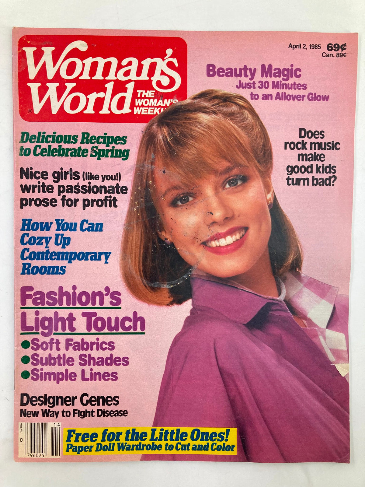 Cover of Woman's World Magazine, April 2, 1985, featuring an engaging headline 'For The Love of Muffin', showcasing a bright and smiling model with brown hair, detailed articles on recipes, fashion tips, and beauty magic.