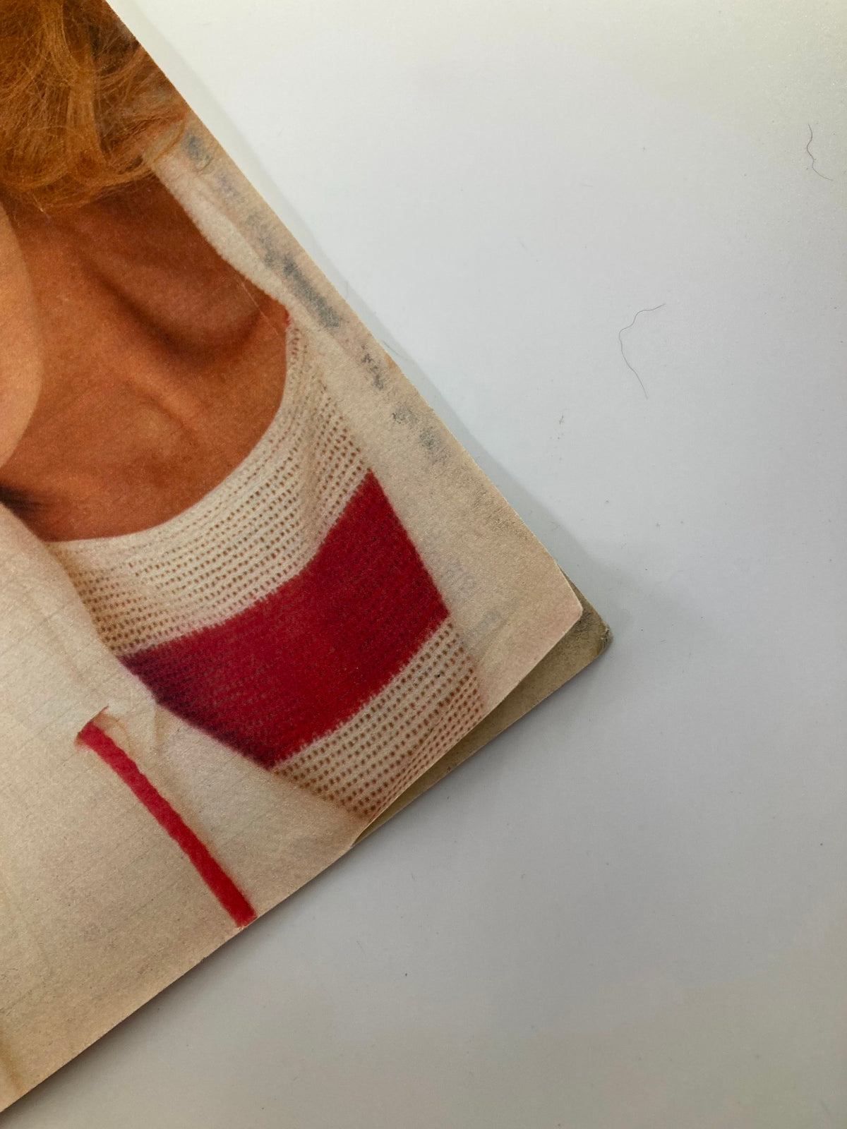Close-up of the edge of Woman's World Magazine, February 5, 1985, highlighting the aged texture and minor wear on the cover.