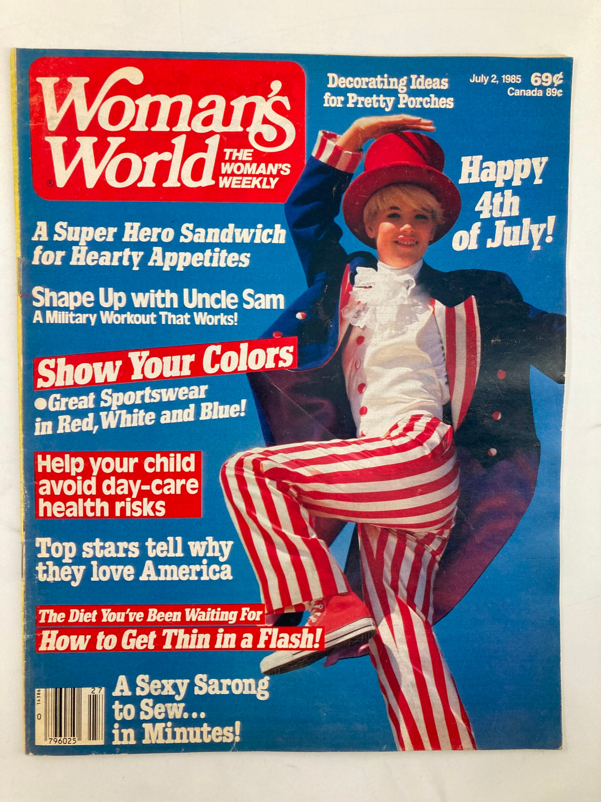 Cover of Woman's World Magazine, July 2, 1985, featuring a joyful child in a stylized patriotic outfit with red and white striped pants and a large top hat, promoting tips on health risks in day-care, 4th of July celebrations, and recipes. Title: 'Woman's World Magazine July 2 1985 Avoid Day-Care Health Risks No Label'.