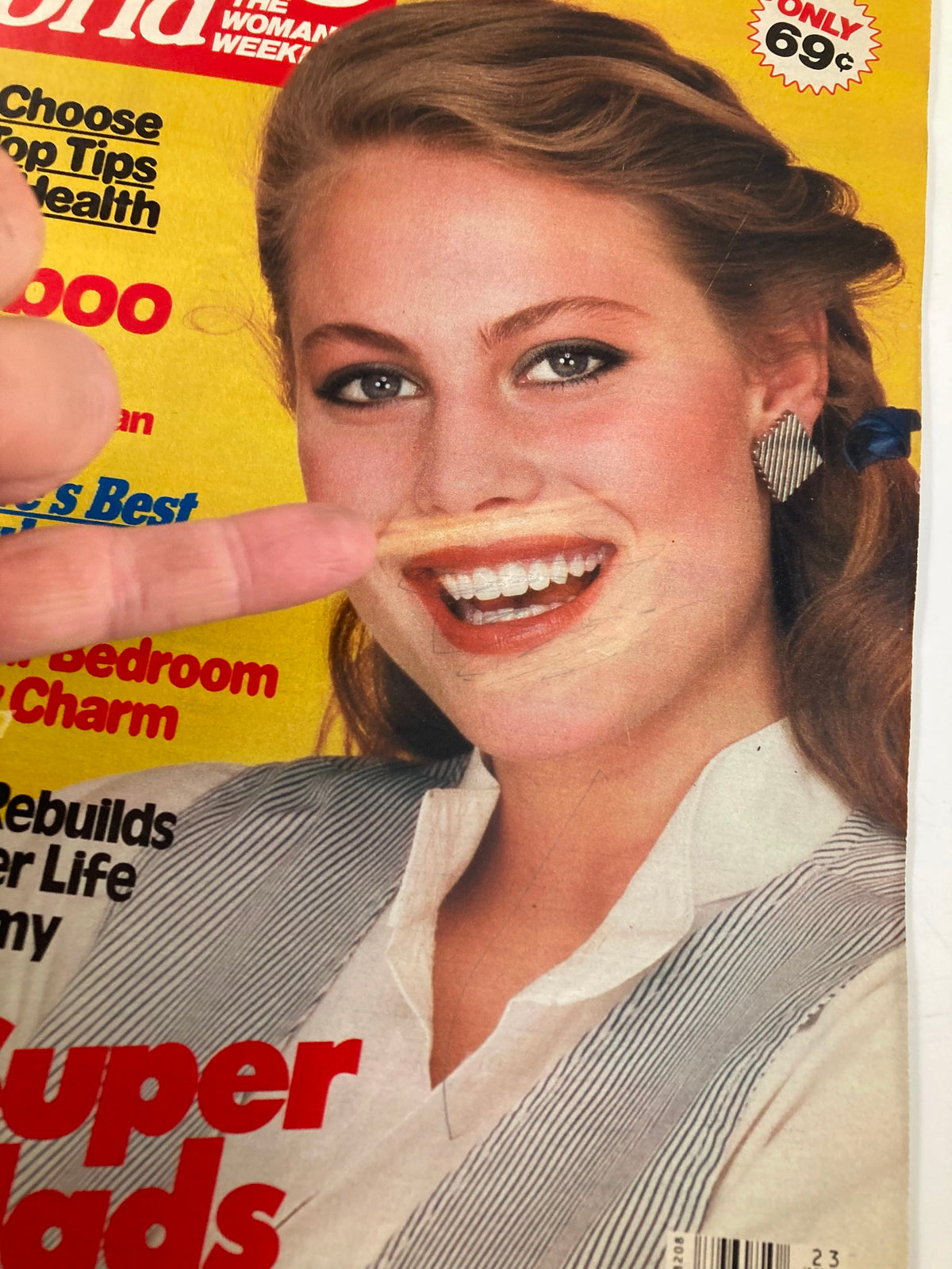 Close-up of the Woman's World Magazine cover from June 10, 1986, highlighting the article 'Her Life After Mastectomy' with details on beauty tips and health advice, featuring a woman with a playful expression.