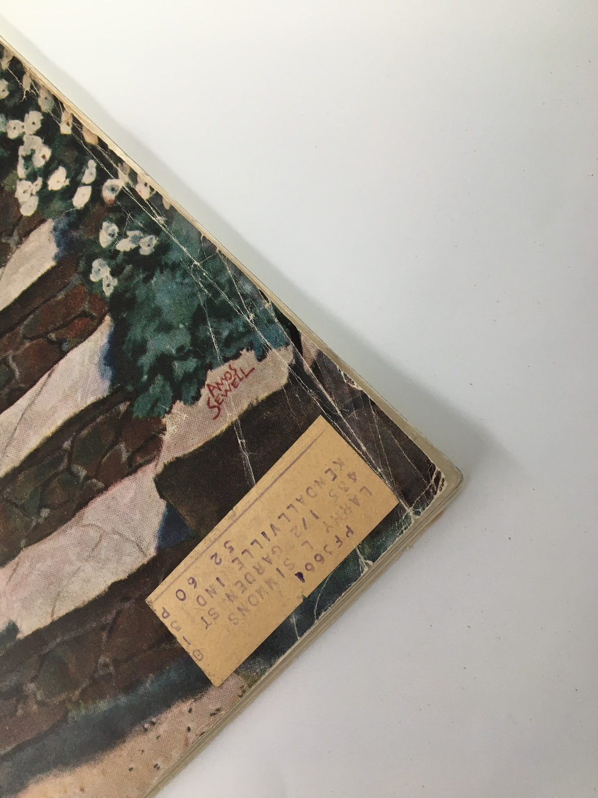 Close-up of the cover corner of The Saturday Evening Post August 3 1957 showing vintage address label and signs of wear.