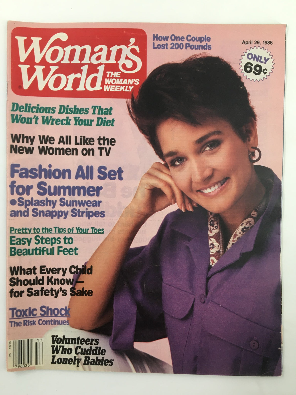 Cover of Woman's World Magazine dated April 29, 1986, featuring a main article on volunteers who cuddle lonely babies, with a smiling woman in a purple outfit. Highlights include features on fashion, diet, and health.