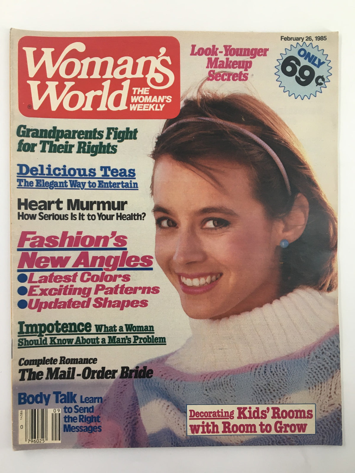 Cover of Woman's World Magazine February 26, 1985, featuring articles on beauty and health, with a smiling woman wearing a colorful sweater and looped text emphasizing 'The Mail-Order Bride'.