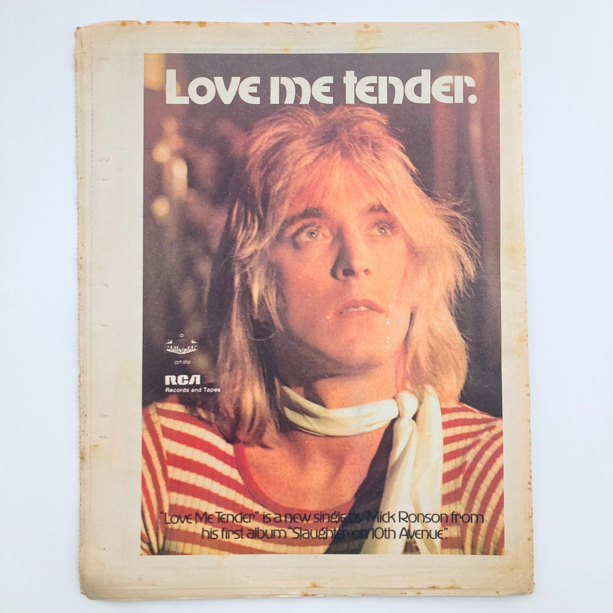 Another inside page of Vintage Rolling Stone Magazine from March 28, 1974, Issue No. 157, featuring promotional content for the new single 'Love Me Tender' by Mick Ronson, thus reflecting the music trends and artist highlights of the era.