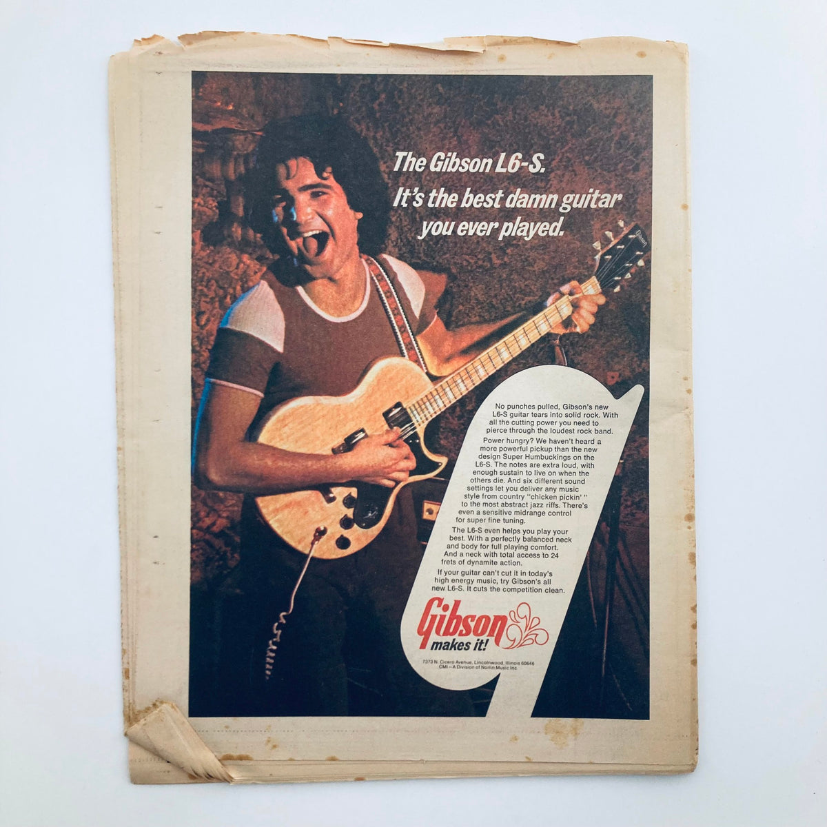 Back cover of Rolling Stone Magazine February 28, 1974, Issue No. 155 featuring an advertisement for the Gibson L6-S guitar, highlighting its quality and performance.