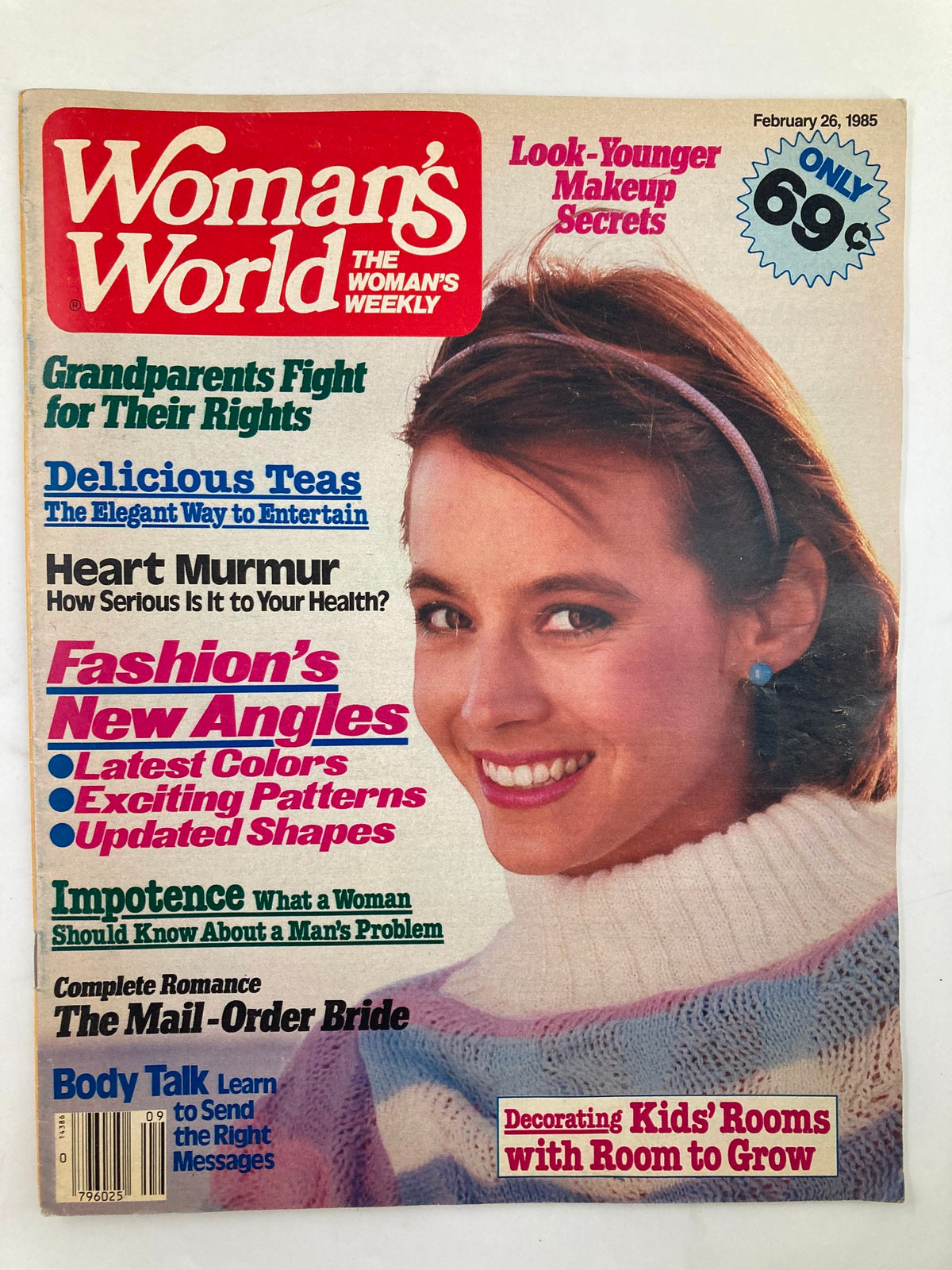 Cover of Woman's World Magazine dated February 26, 1985 featuring a smiling woman in a cozy sweater, with headlines including 'Decorating Kid's Rooms with Room to Grow' and 'Look-Younger Makeup Secrets'.