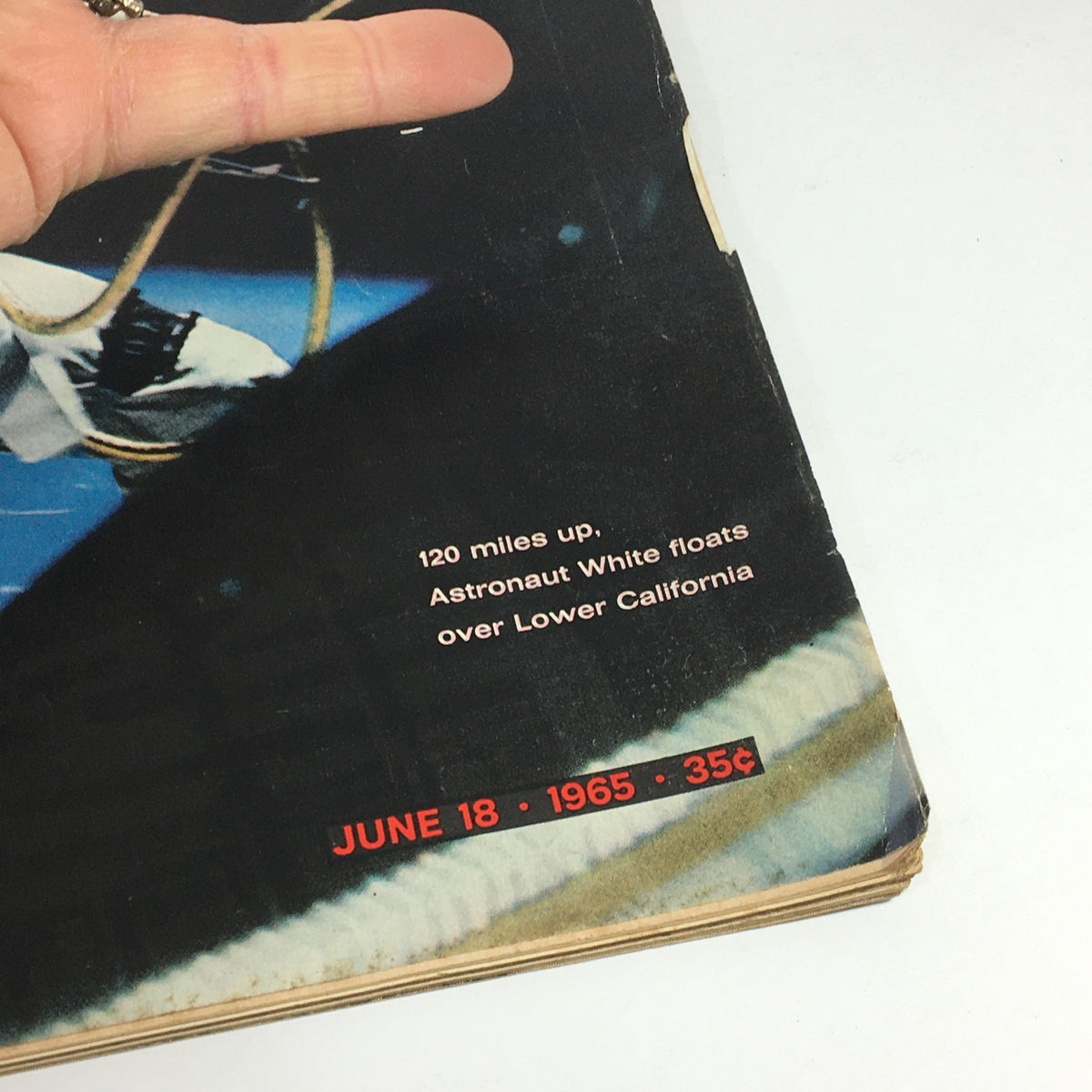 Close-up view of the cover of VTG Life Magazine June 18 1965, featuring details about Astronaut White’s historic spacewalk, including the date and price, highlighting its significance in space exploration.