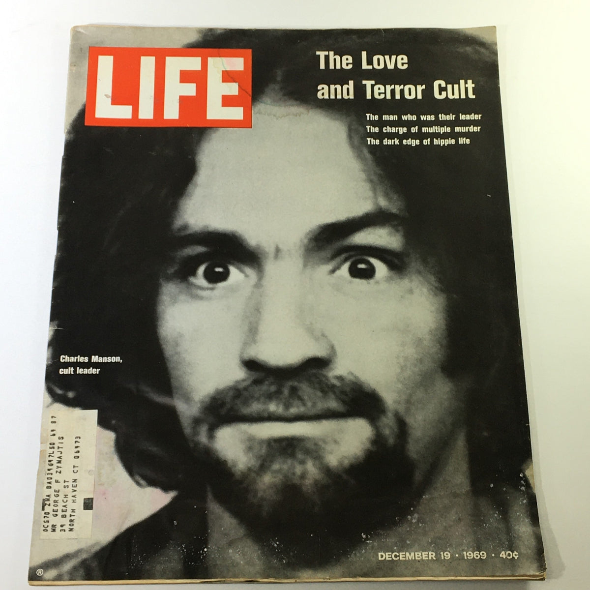Vintage Life Magazine cover from December 19, 1969, featuring Charles Manson, cult leader, with the headline 'The Love and Terror Cult.' A striking black and white photo that reflects the dark side of the hippie era.