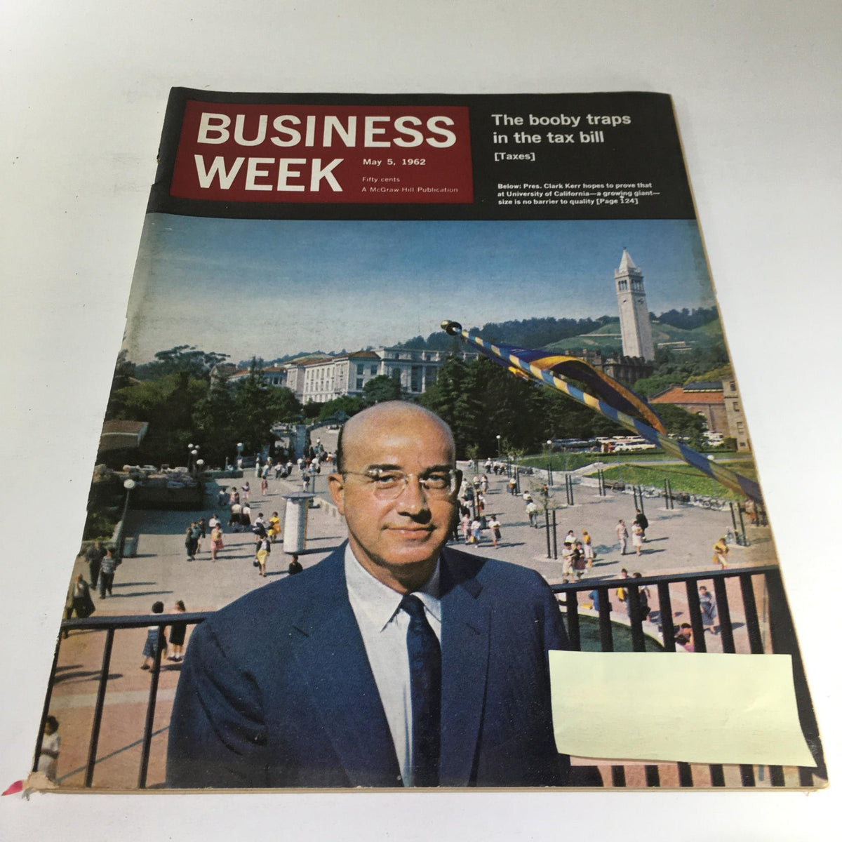 Cover of Business Week Magazine from May 5, 1962, featuring President Clark Kerr with a background of a university campus and people walking, highlighting the magazine's historical significance in business and politics.