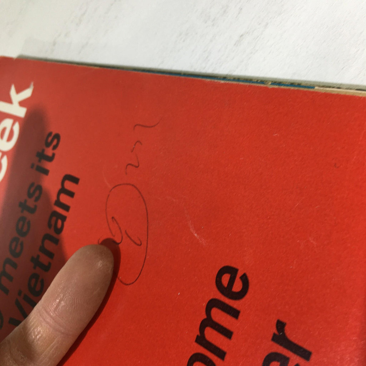 Close-up view of the Business Week Magazine from June 24, 1967, showing a handwritten signature on the cover. This vintage magazine features the cover story 'How To Become The Top Insurer.'