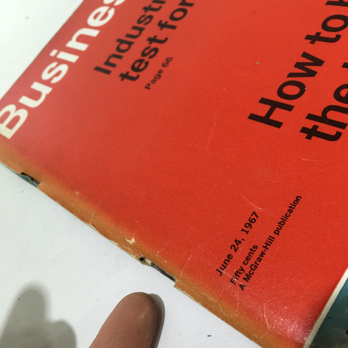 Side view of the Business Week Magazine from June 24, 1967, highlighting the publication details and edges of the magazine, which features the article 'How To Become The Top Insurer.'