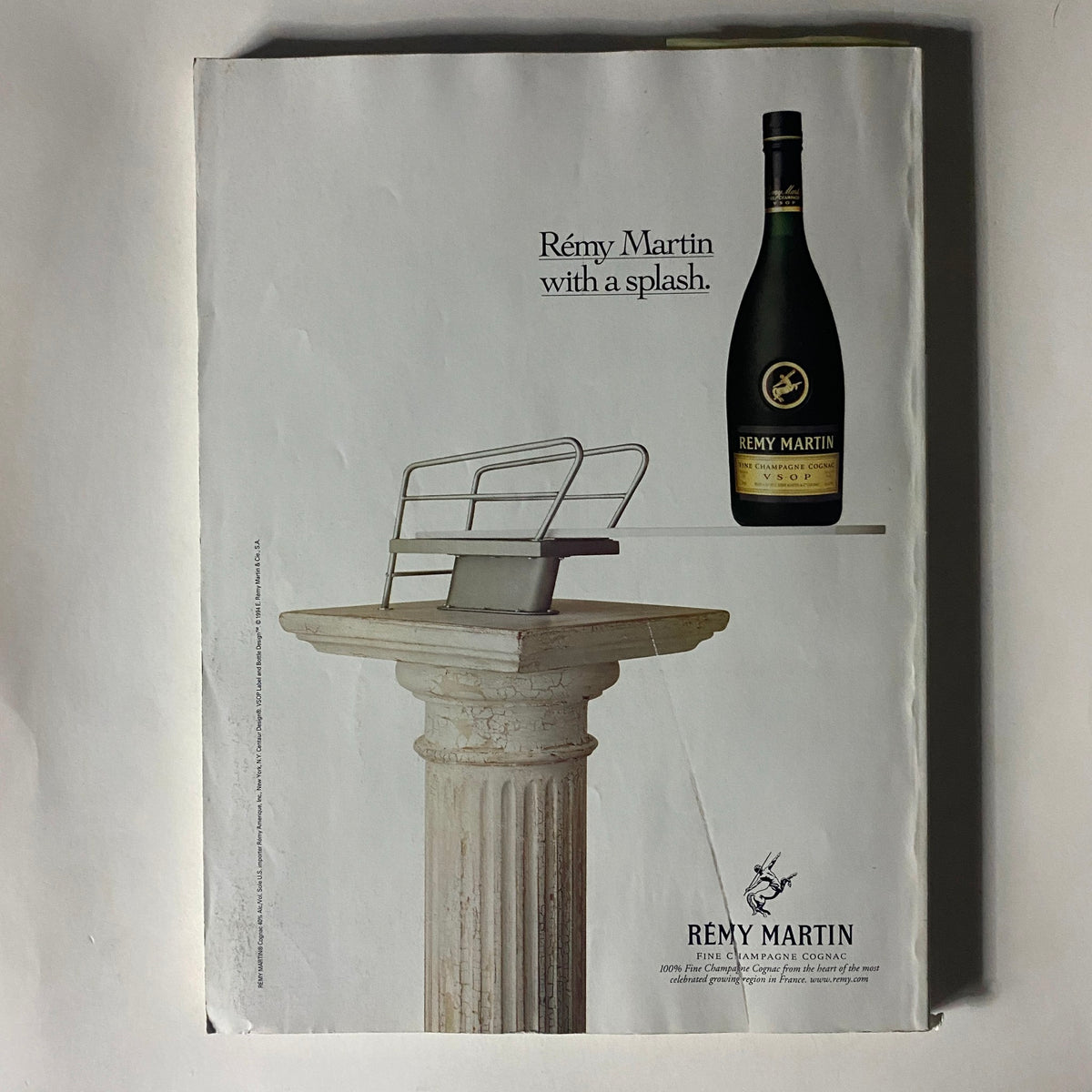 Back cover of Fortune Magazine November 24, 1997, showcasing a Rémy Martin advertisement featuring a bottle of VSOP cognac on an artistic pedestal.