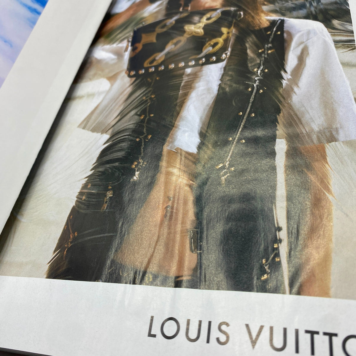 Inside page of Vogue Magazine March 2016 highlighting a stylish outfit from Louis Vuitton, reflecting contemporary fashion trends.