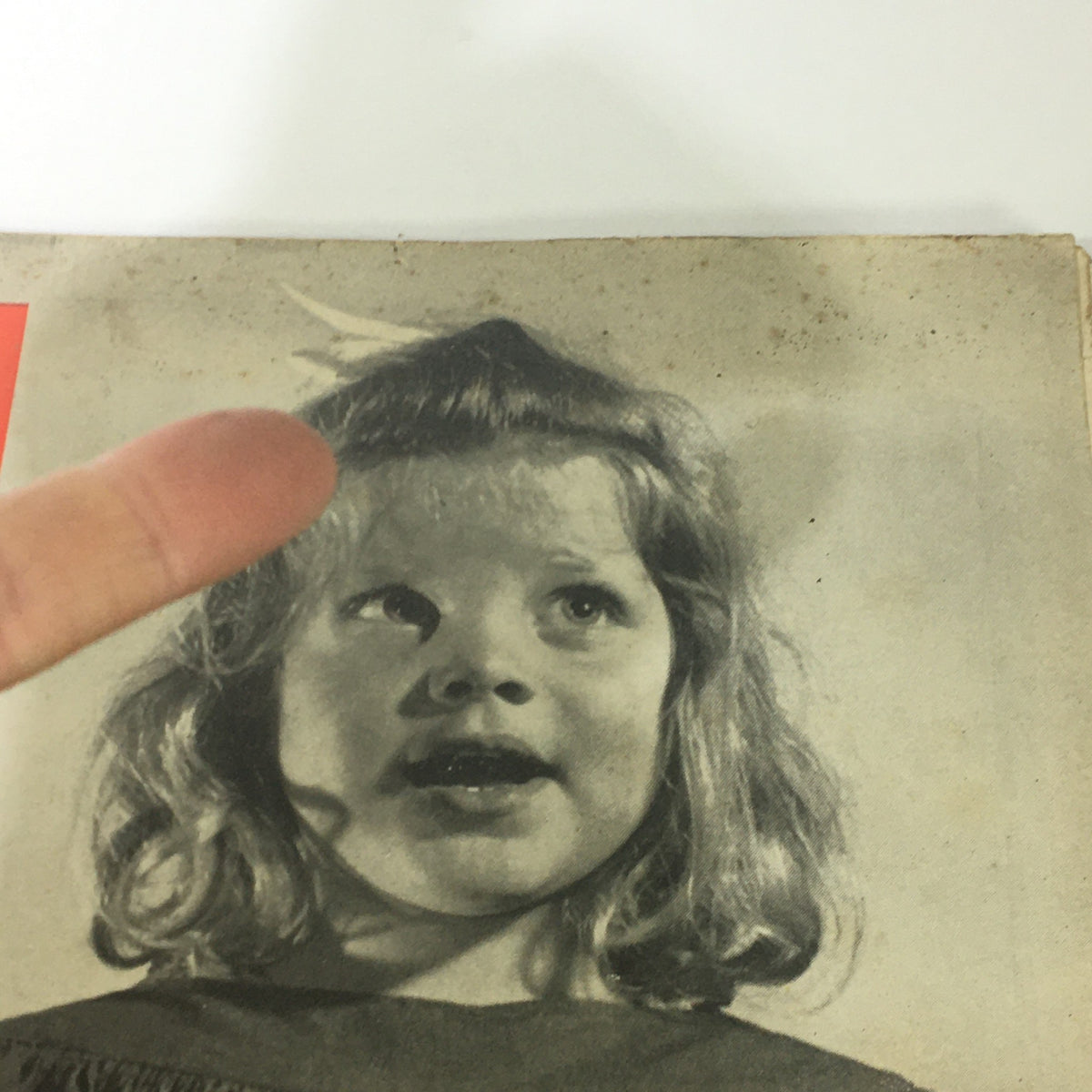 Close-up of a young girl from the VTG Life Magazine June 3, 1946, singing with a joyful expression.