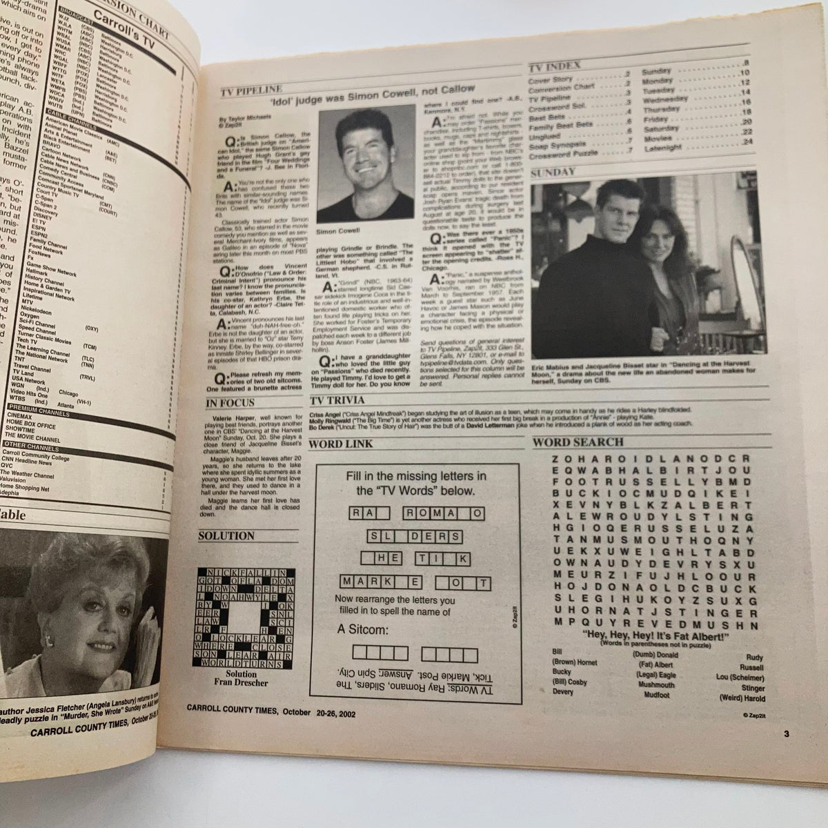 Inside page of TV Week Magazine October 20, 2002, displaying a TV schedule, trivia, and crossword puzzle, with Simon Cowell mentioned.