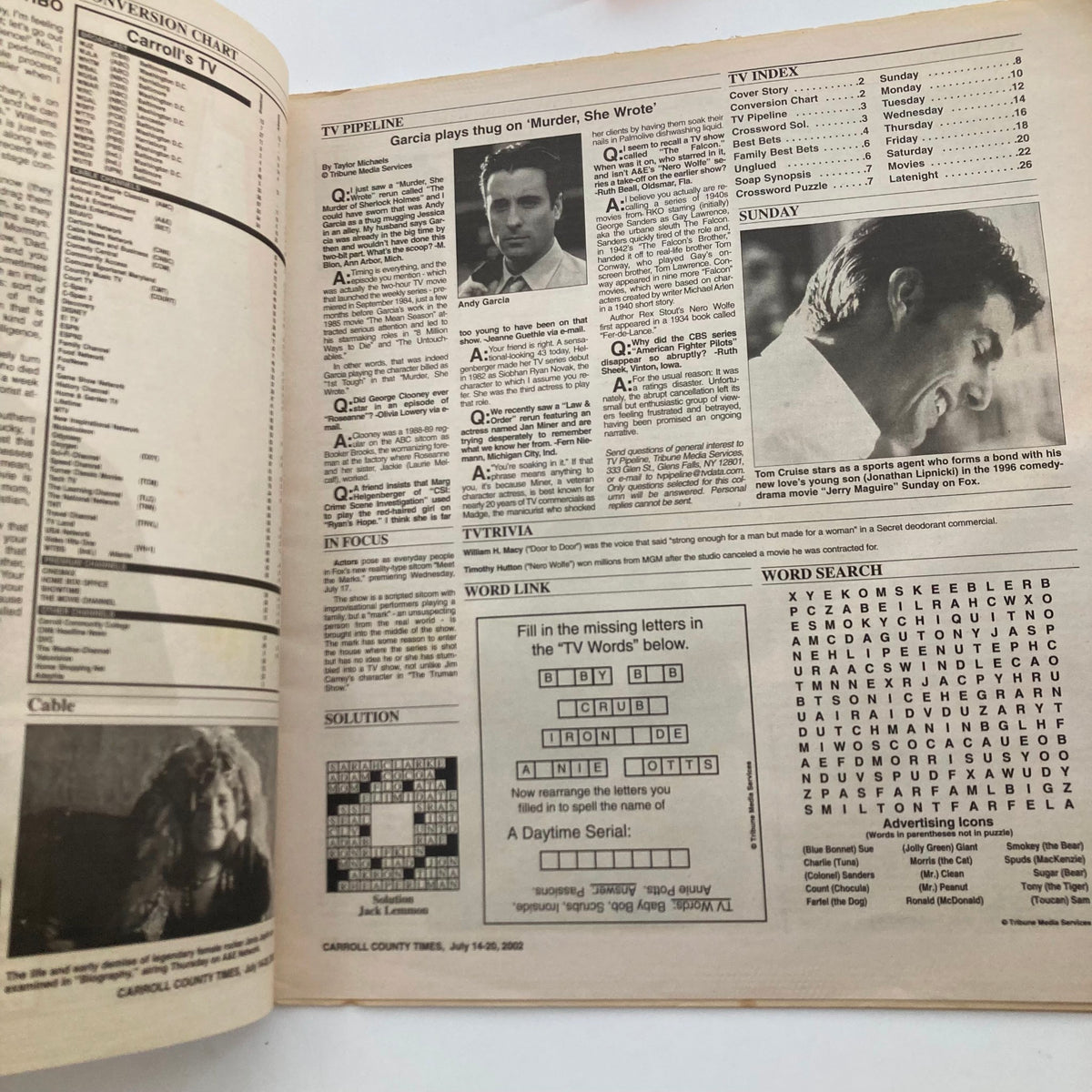 Inside view of TV Week Magazine dated July 14, 2002 featuring TV programming listings and a crossword puzzle.