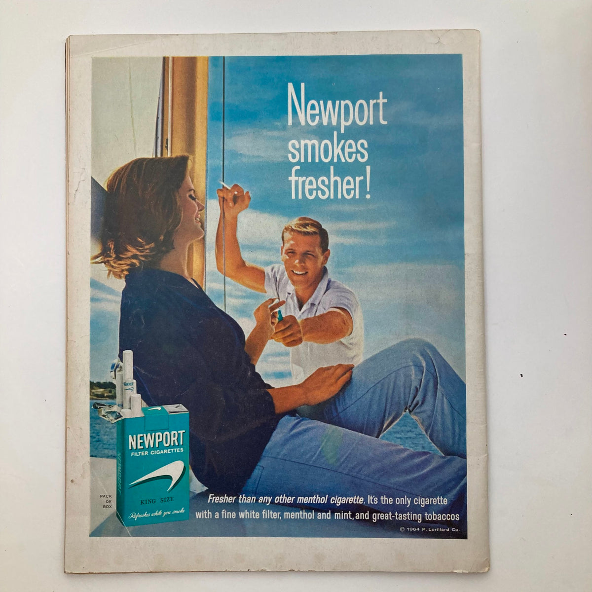Advertisement for Newport cigarettes from The Saturday Evening Post, March 21, 1964, showcasing a couple on a boat with a focus on freshness.