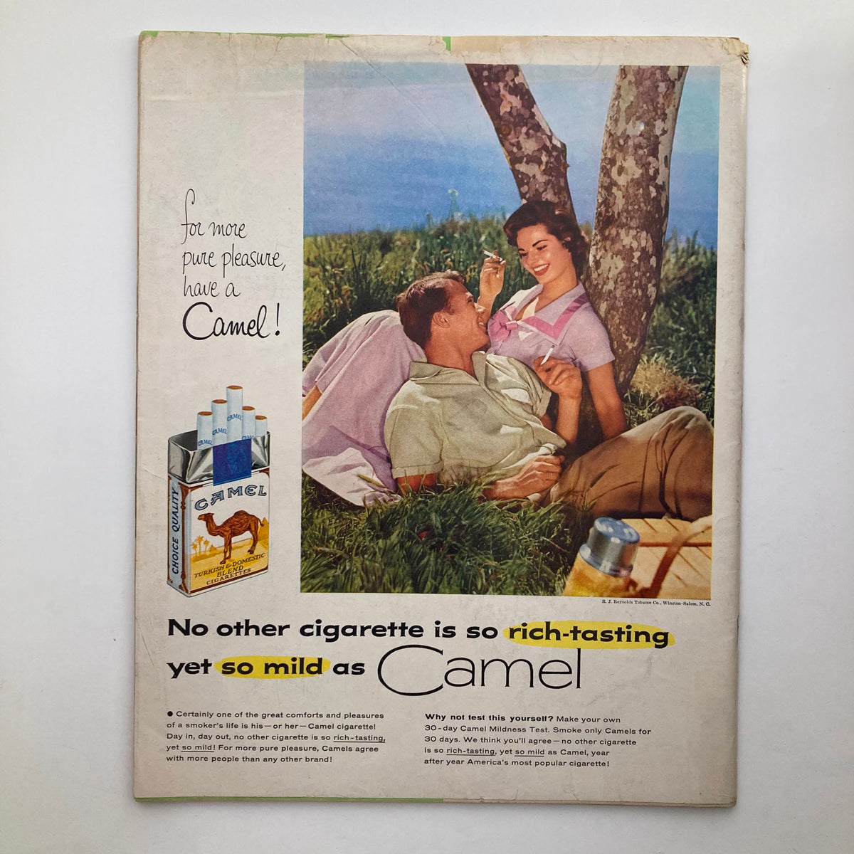 Back cover of Look Magazine, June 14, 1955, featuring a vintage advertisement for Camel cigarettes with a couple enjoying a picnic.