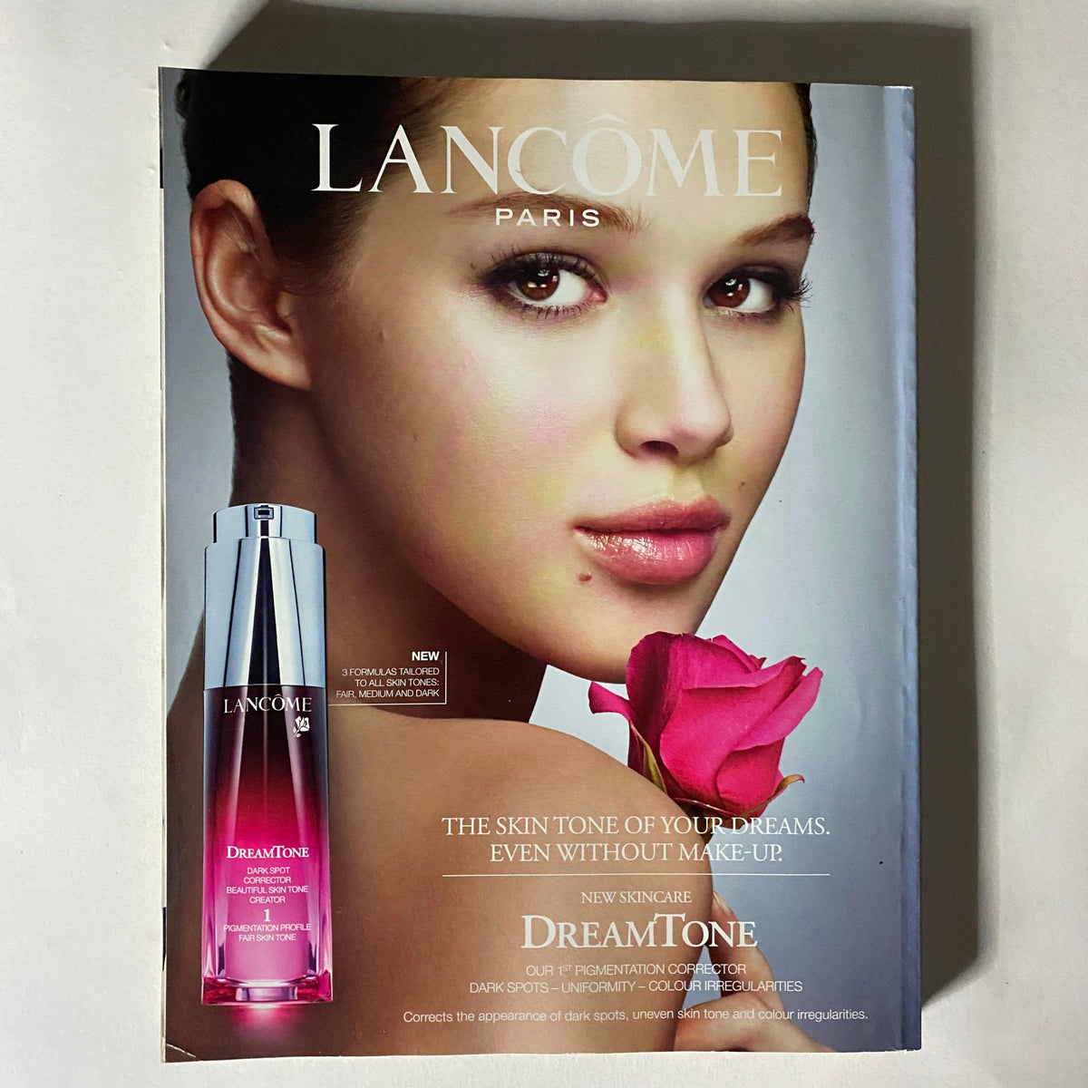 Interior page of Elle UK Magazine October 2013 featuring a Lancôme advertisement promoting DreamTone skincare.