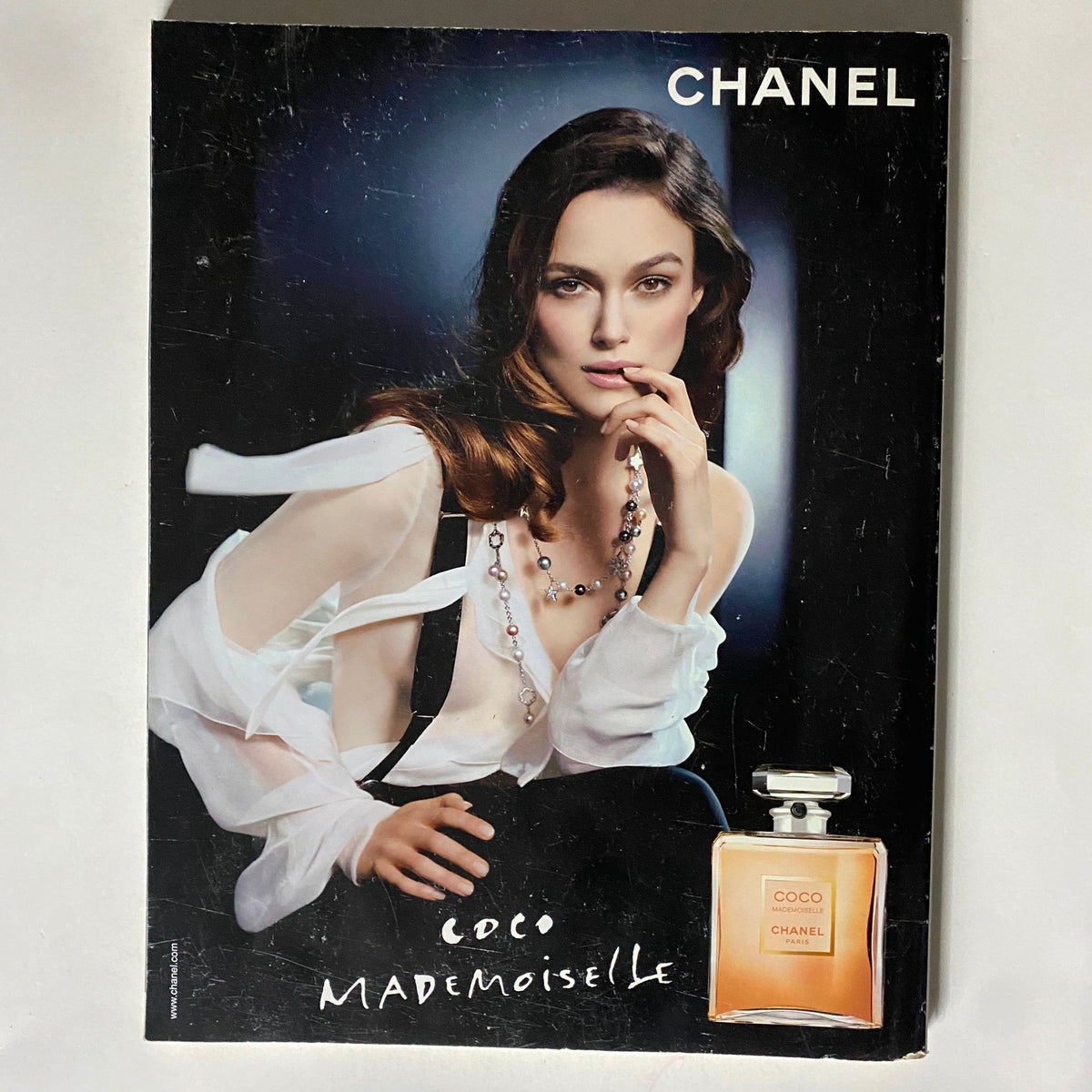 Chanel advertisement featuring a model promoting COCO MADEMOISELLE perfume from Vogue UK Magazine February 2010.
