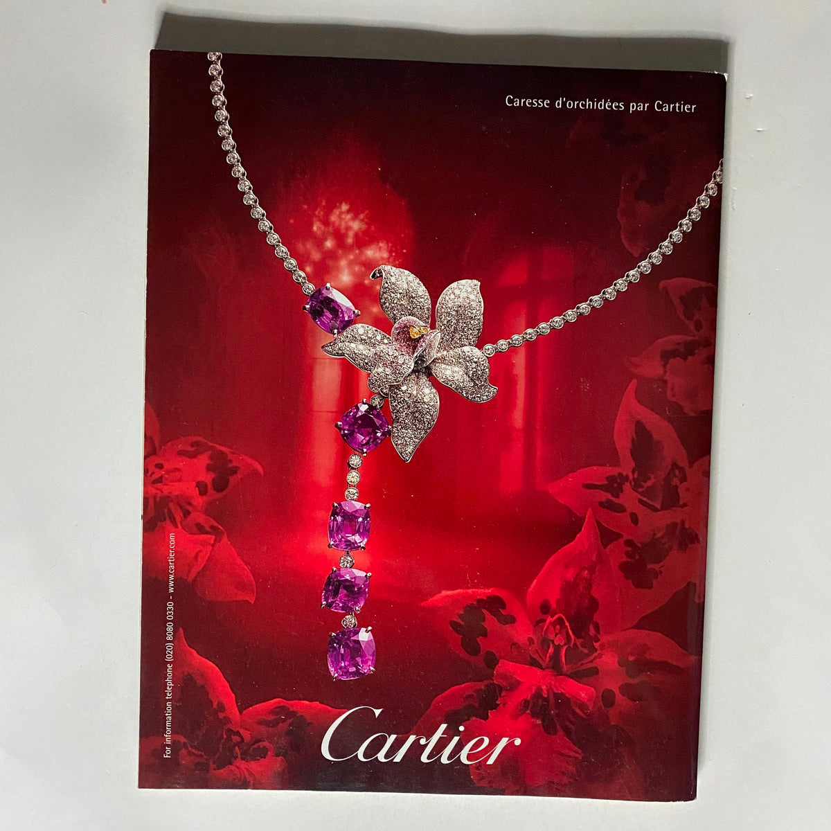 Cartier advertisement from Vogue UK Magazine January 2006 displaying exquisite jewelry design, showcasing luxury and elegance.