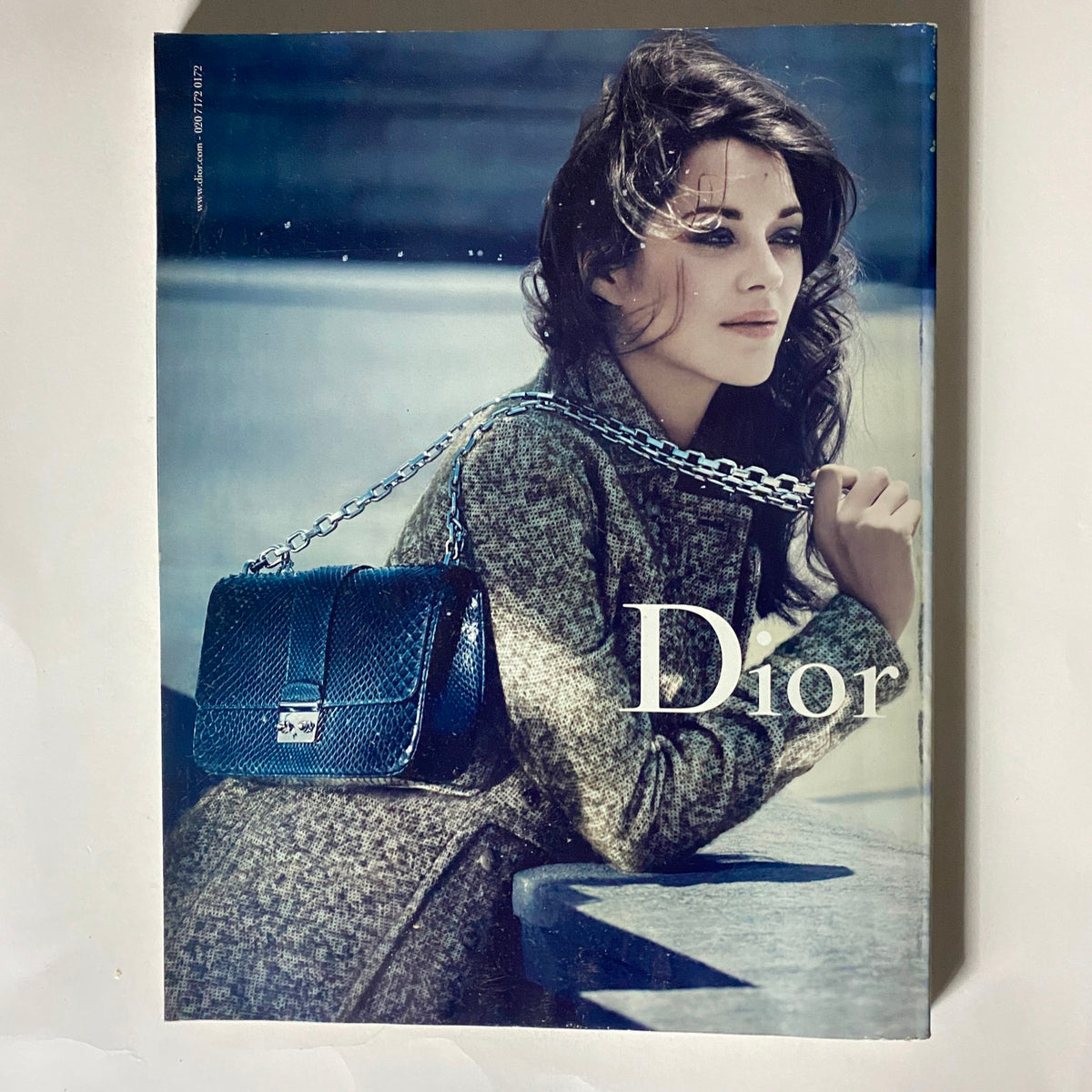 Cover of Vogue UK Magazine December 2011 featuring Gisele Bündchen, showcasing the fashion design of Dior with a model holding a stylish handbag.