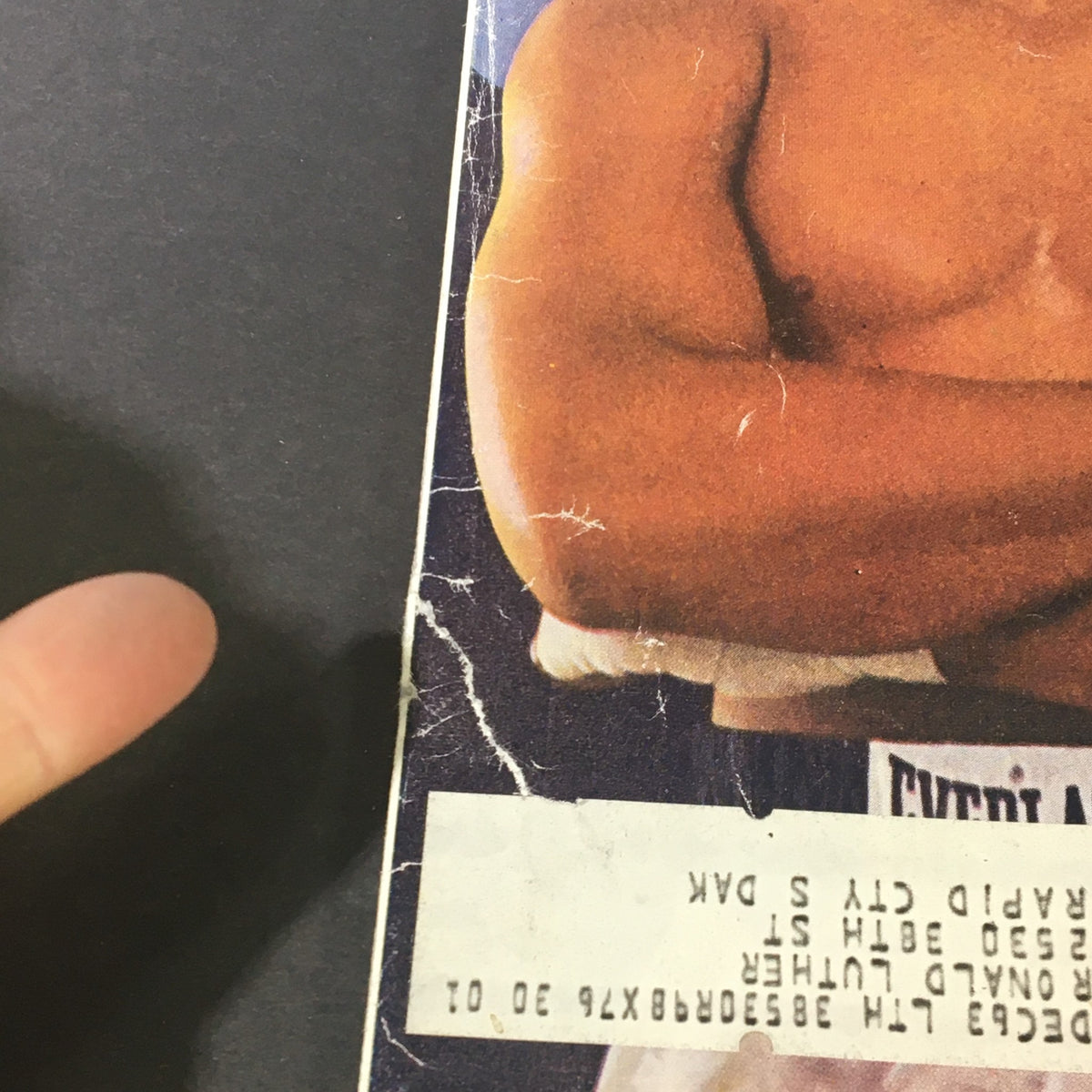 Cover detail of the VTG Sports Illustrated Magazine June 10 1963 Muhammad Ali Invades Britain, highlighting a close-up of Muhammad Ali's upper body with visible wear.