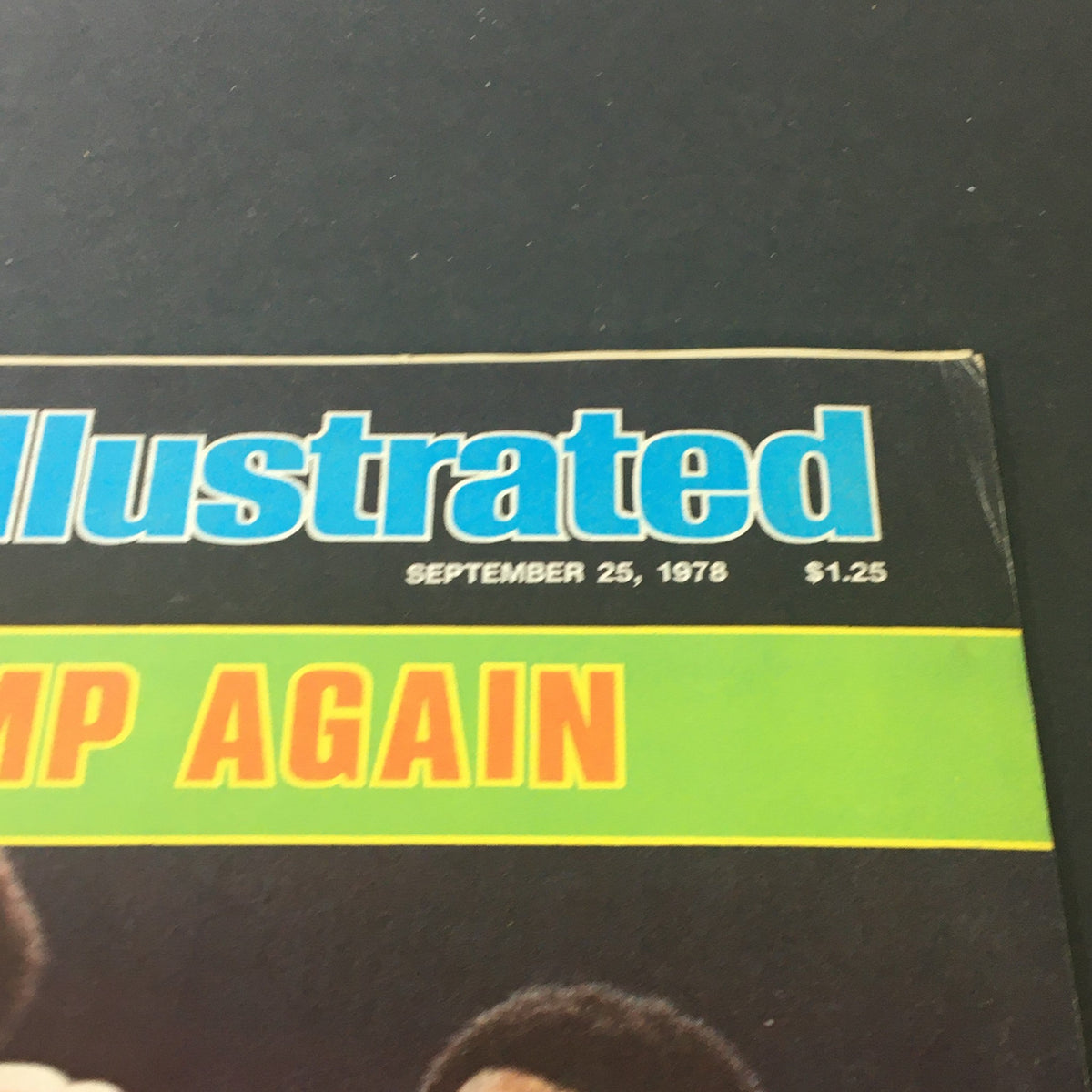 Close-up of the Vintage Sports Illustrated Magazine September 25, 1978, highlighting the title 'THE CHAMP AGAIN' and featuring Muhammad Ali and Leon Spinks.