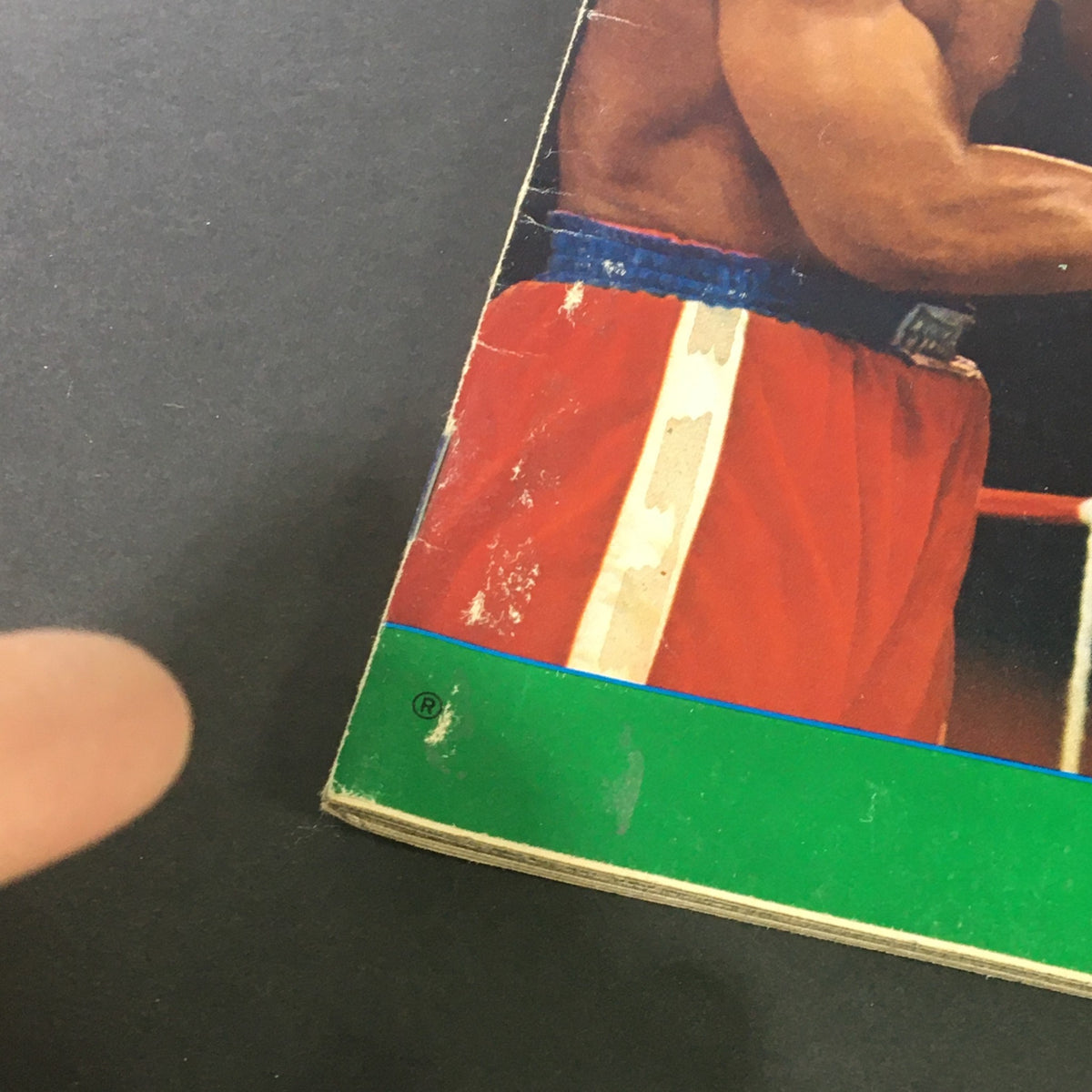 Close-up of the corner of Sports Illustrated Magazine November 11 1974, featuring wear and tear, showcasing George Foreman vs Cassius Clay cover story.