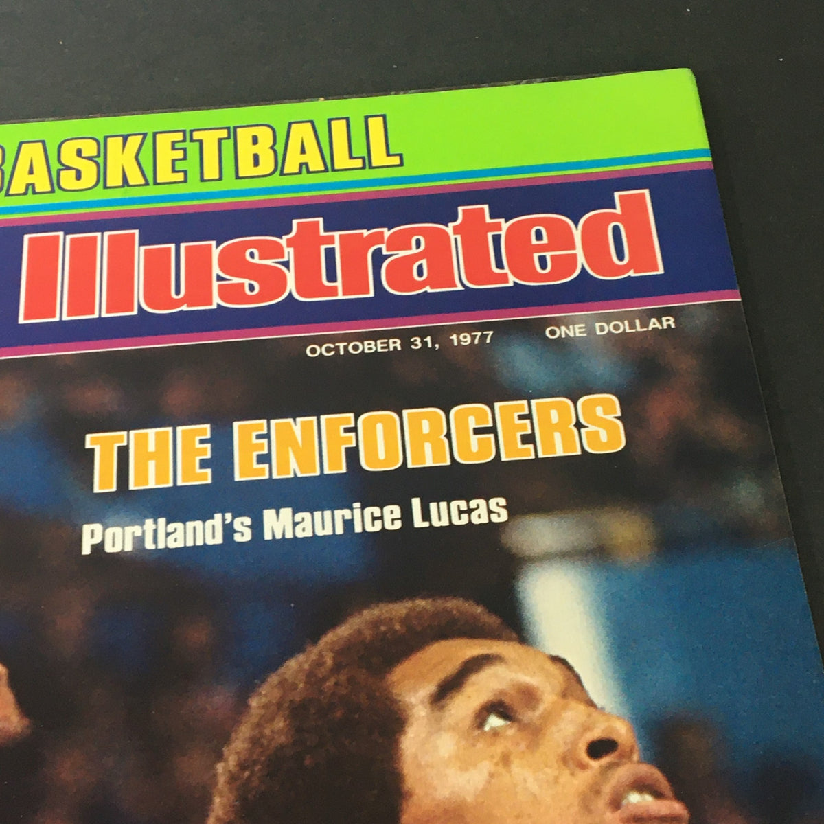 Close-up of the Sports Illustrated Magazine cover from October 31, 1977, showcasing 'The Enforcers' with emphasis on Portland's Maurice Lucas.