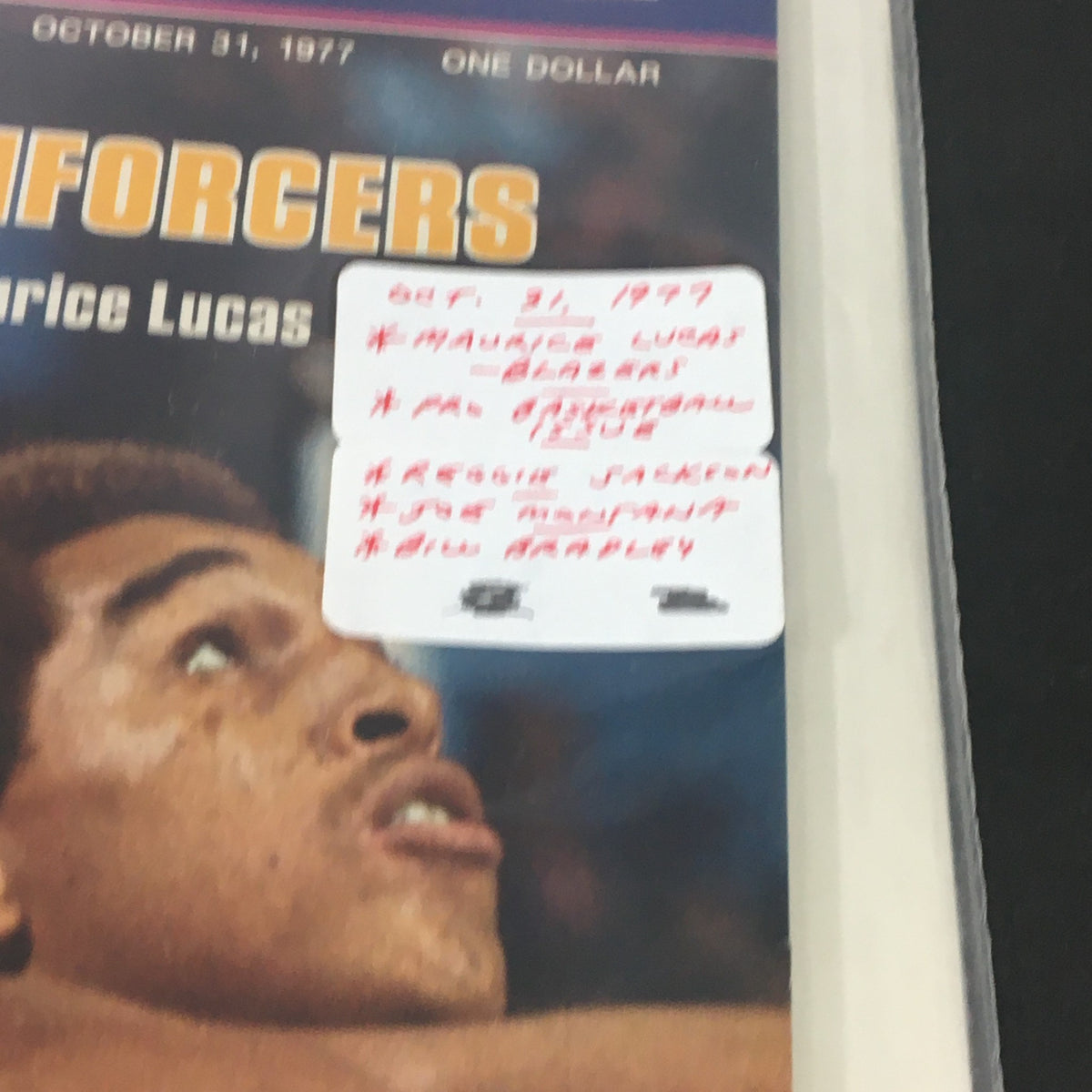 In-depth view of the Sports Illustrated Magazine cover dated October 31, 1977, displaying 'The Enforcers' and Portland's Maurice Lucas, with handwritten notes on the side.