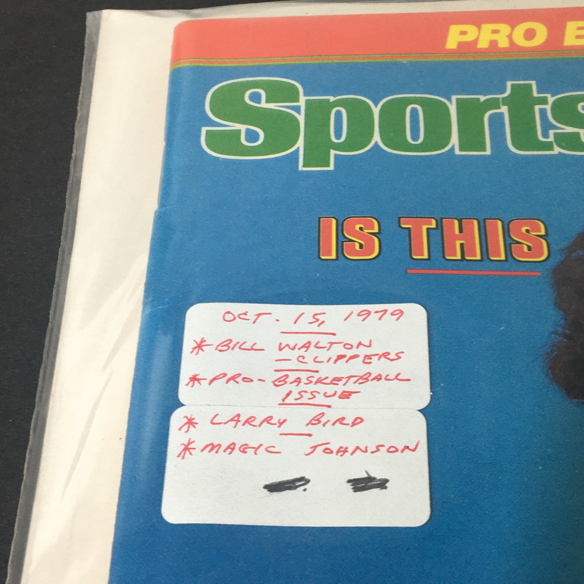 Close-up of the vintage Sports Illustrated Magazine cover from October 15, 1979 highlighting Bill Walton, Larry Bird, and Magic Johnson with handwritten notes, representing a key basketball era.