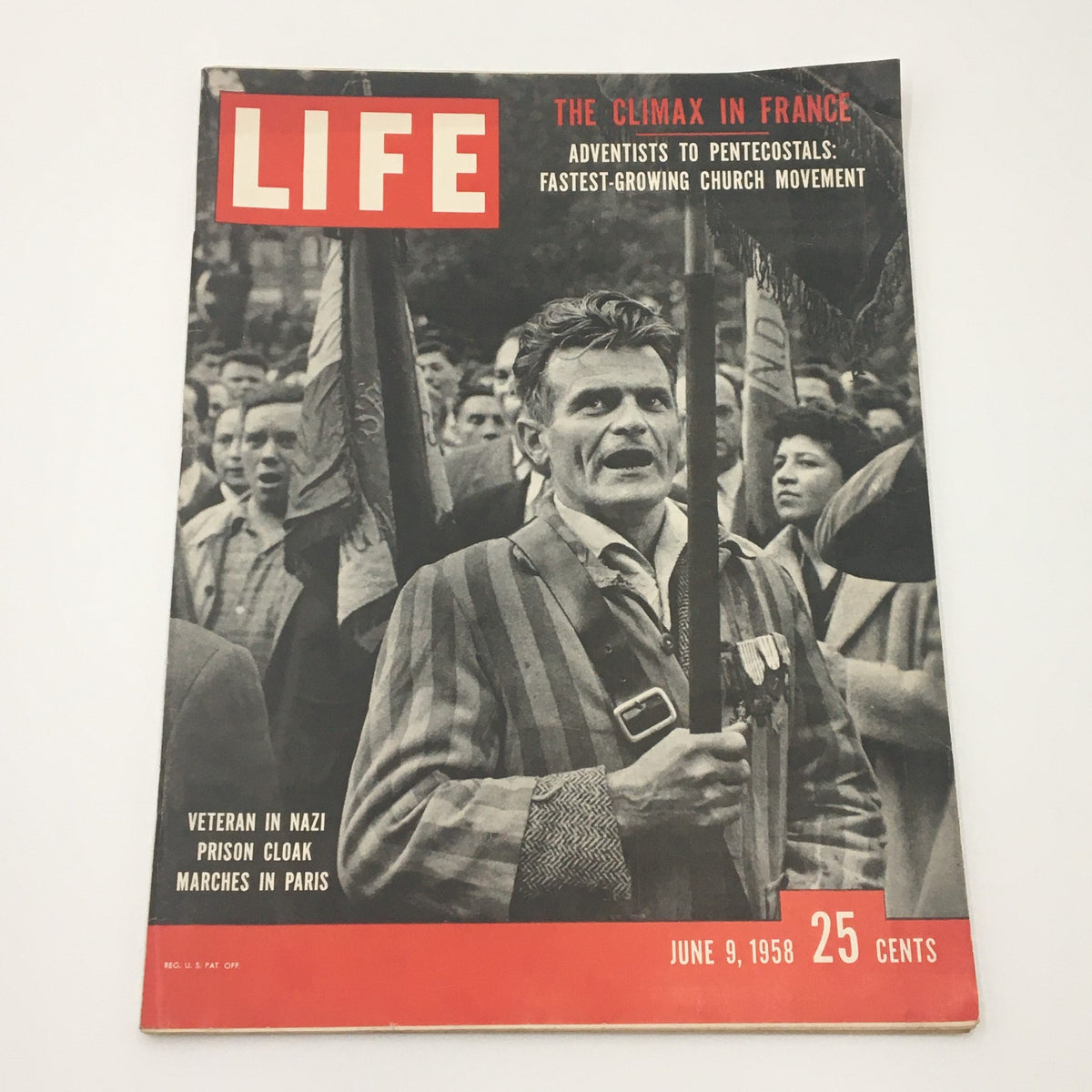 VTG Life Magazine June 9 1958 featuring a veteran in a Nazi prison cloak on the cover, highlighting historical events and capturing a significant moment from the past.