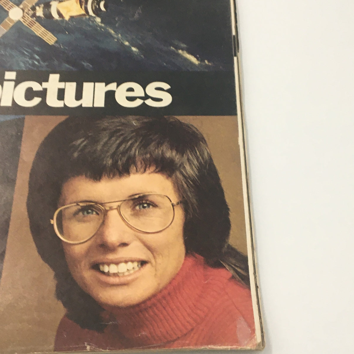 Detail view of a woman wearing glasses on the cover of VTG Life Magazine Special: The Year in Pictures of 1973, showcasing cultural moments from that year.