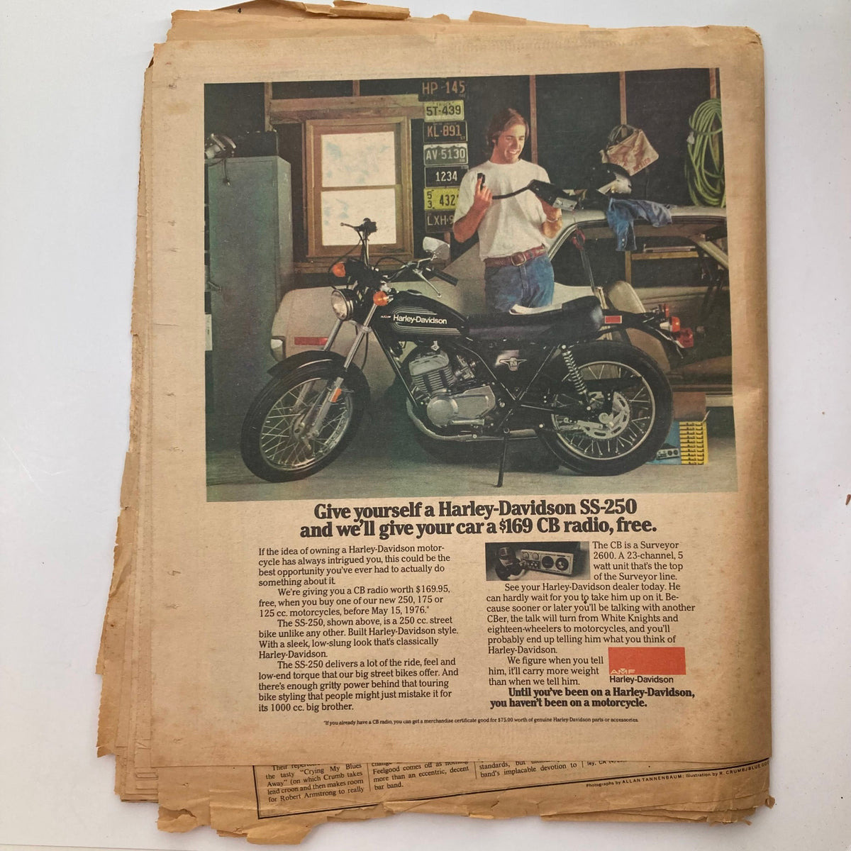 Advertisement from the VTG Rolling Stone Magazine dated May 6, 1976, showcasing a Harley-Davidson SS-250 motorcycle promotion with a smiling person and garage backdrop.
