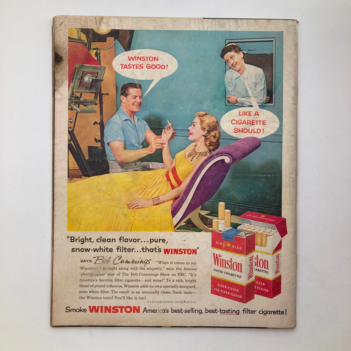 Vintage Look Magazine from May 27, 1958 featuring an advertisement for Winston cigarettes, showcasing a man and a woman in mid-century American fashion. The illustration captures the charm of the era, highlighting playful dialogue in speech bubbles.